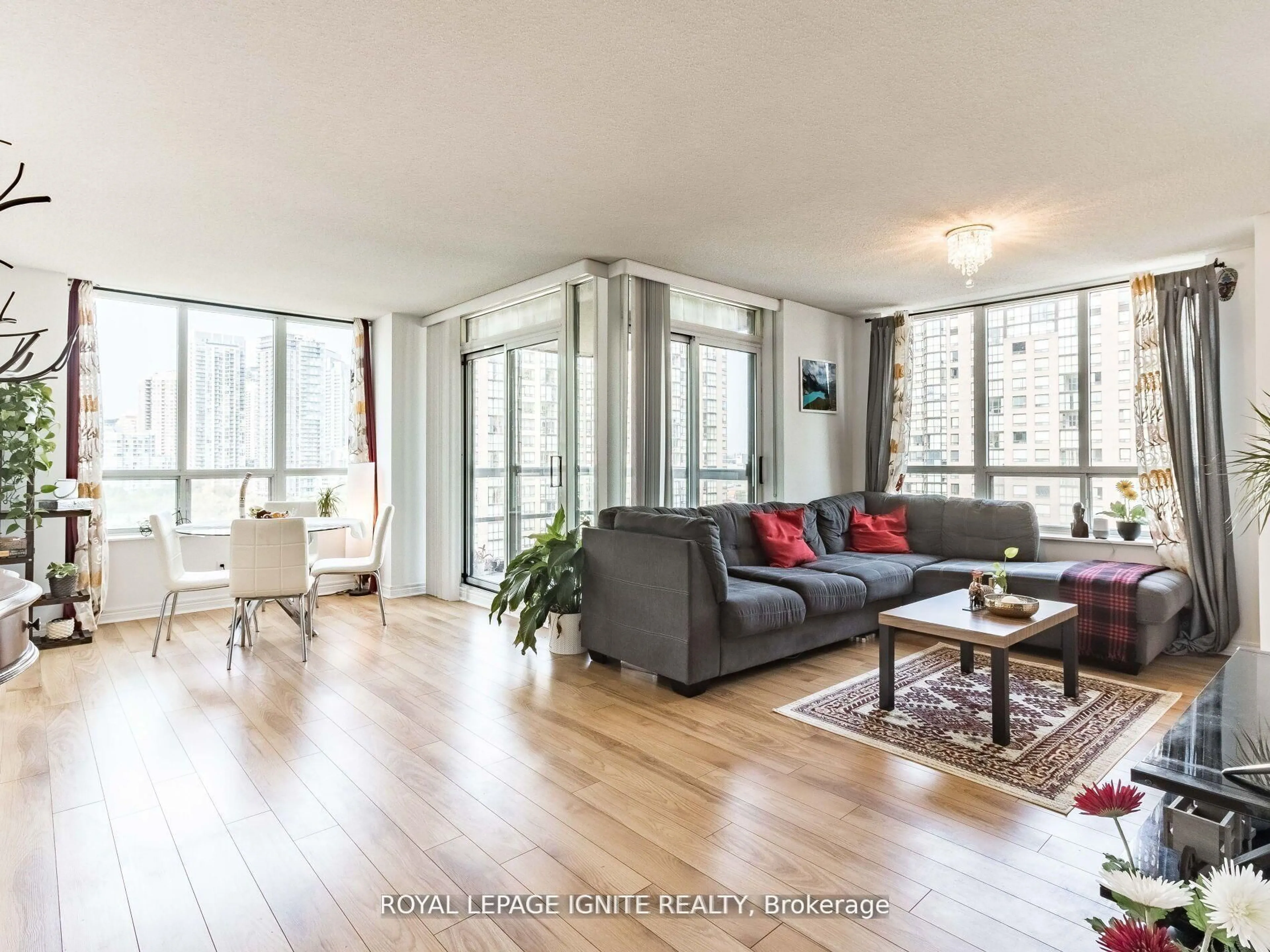 Living room with furniture, wood/laminate floor for 156 Enfield Pl #1711, Mississauga Ontario L5B 4L8