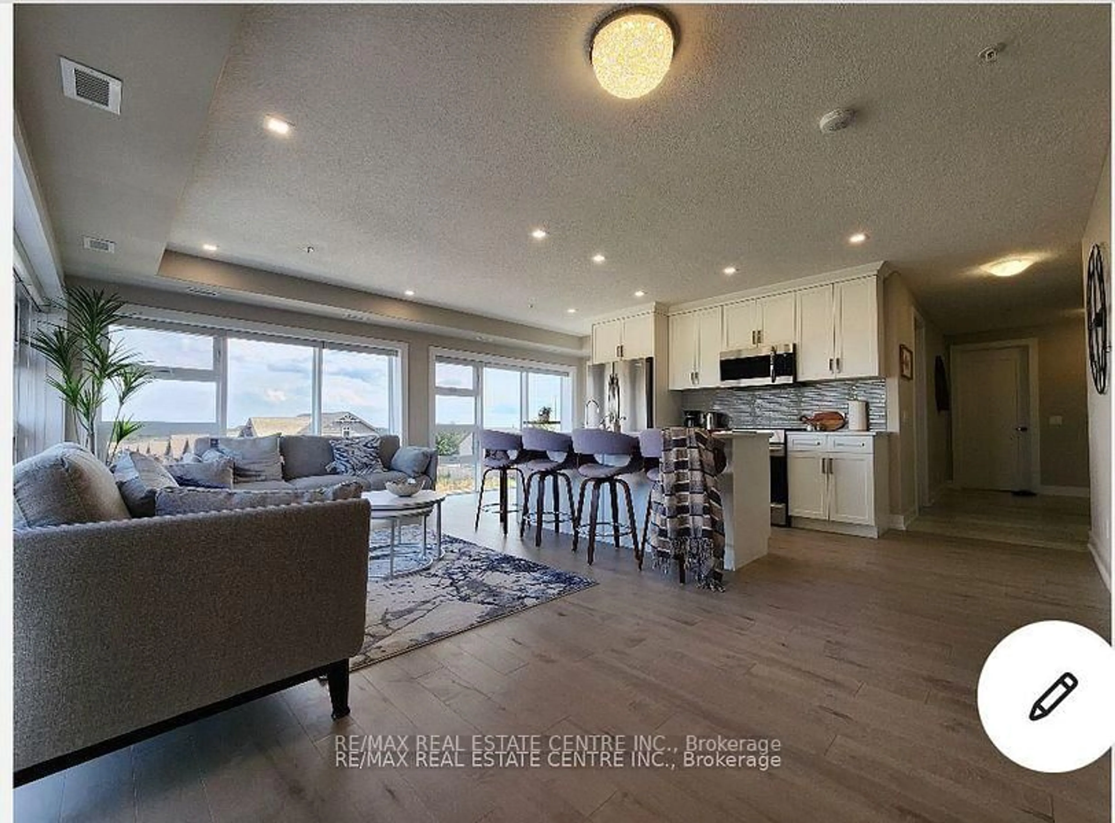 Open concept kitchen, wood/laminate floor for 105 Spencer Ave #305, Orangeville Ontario L9W 7S3