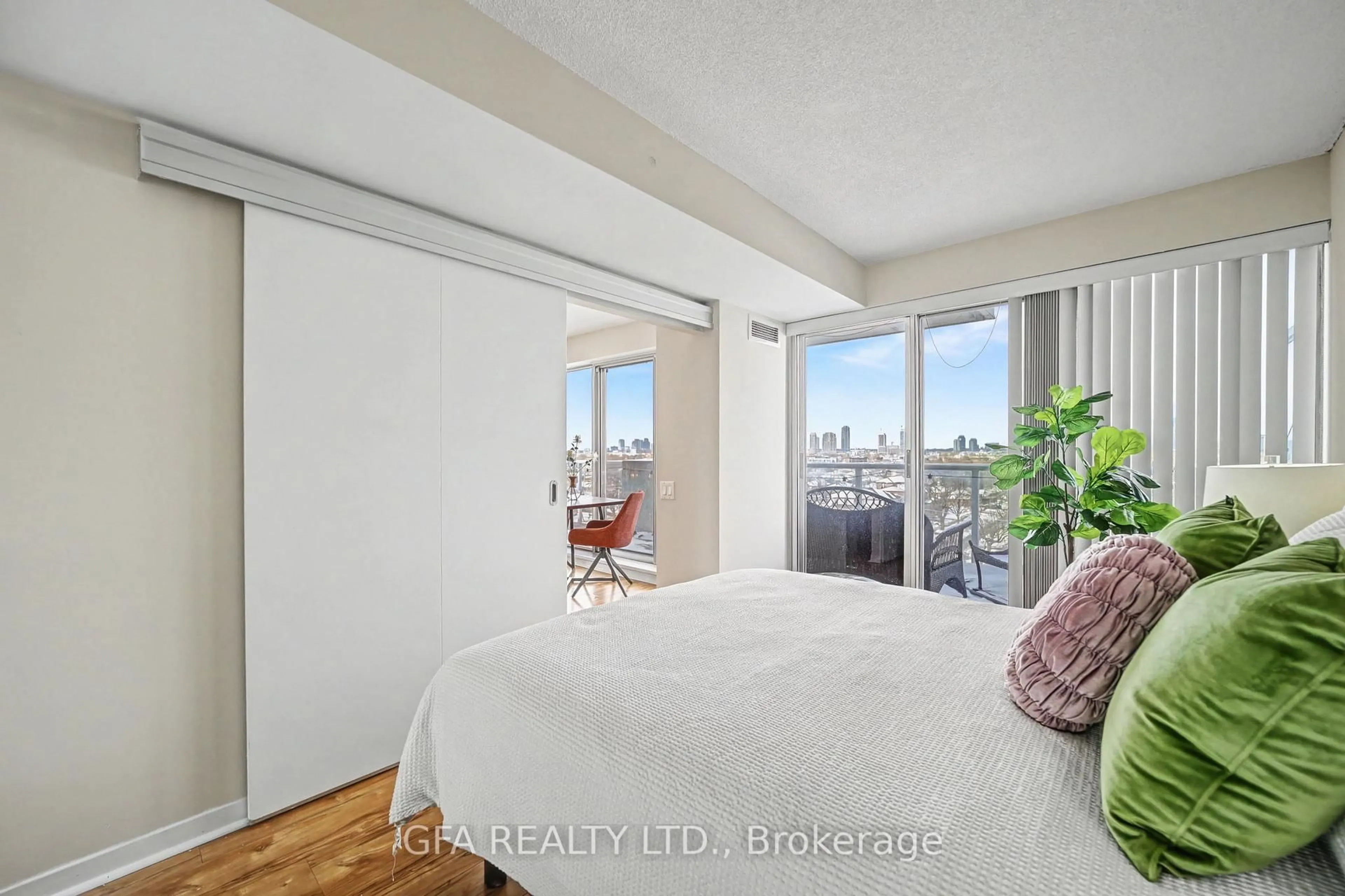 Bedroom with bed, wood/laminate floor for 1040 The Queensway St #720, Toronto Ontario M8Z 0A7