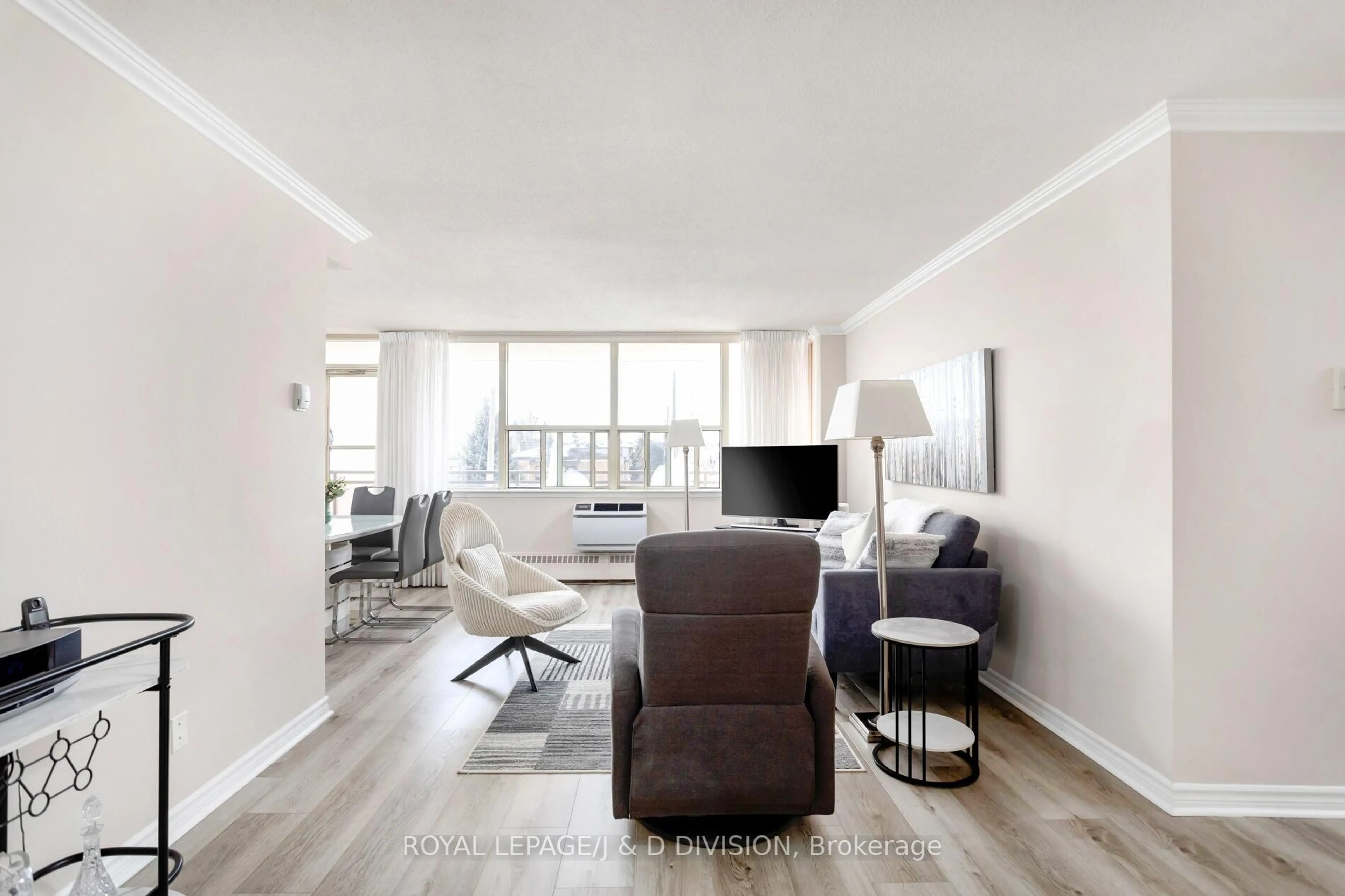 Living room with furniture, wood/laminate floor for 155 Marlee Ave #306, Toronto Ontario M6B 4B5