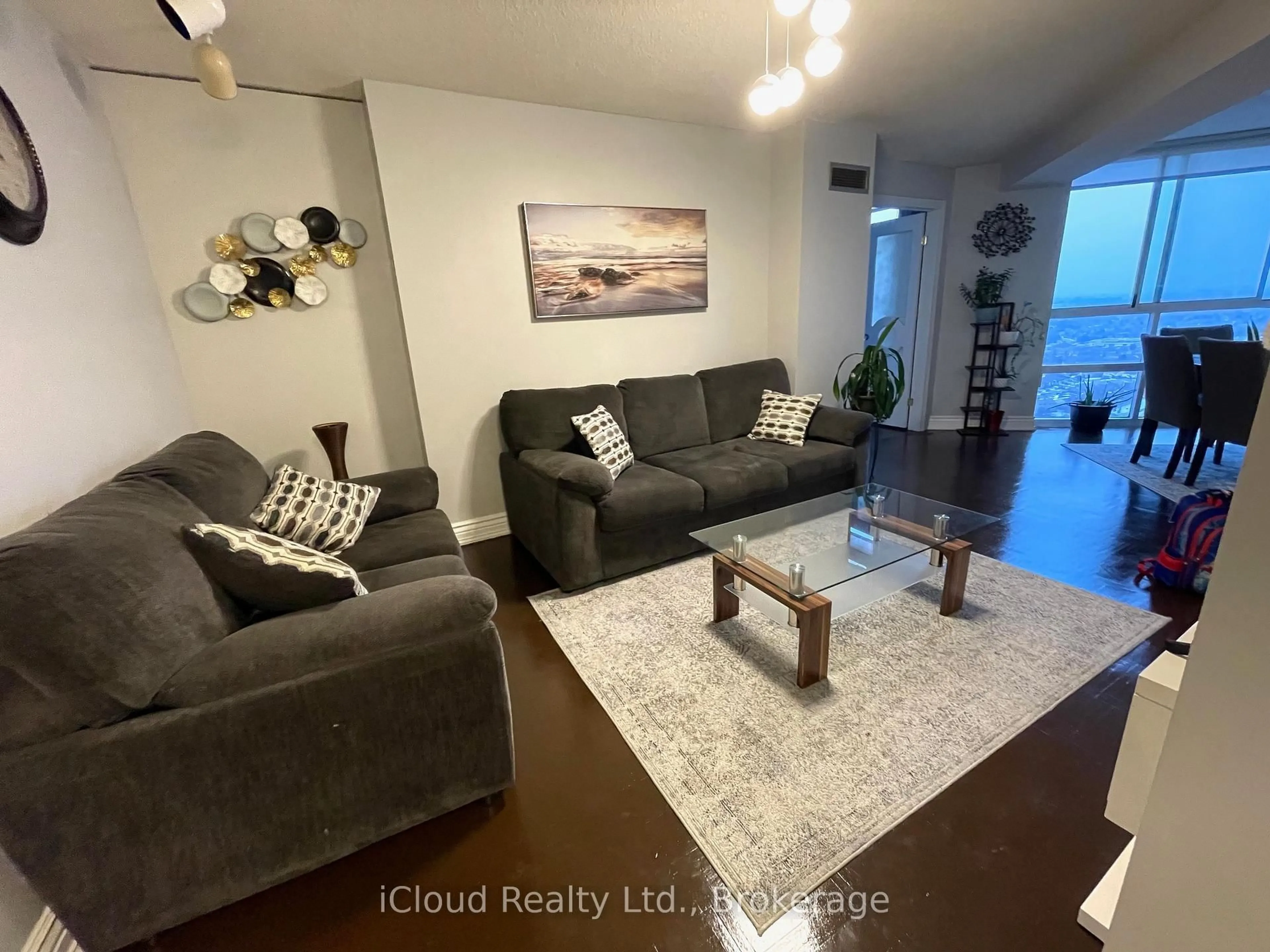 Living room with furniture, wood/laminate floor for 3650 Kaneff Cres #3208, Mississauga Ontario L5A 4A1