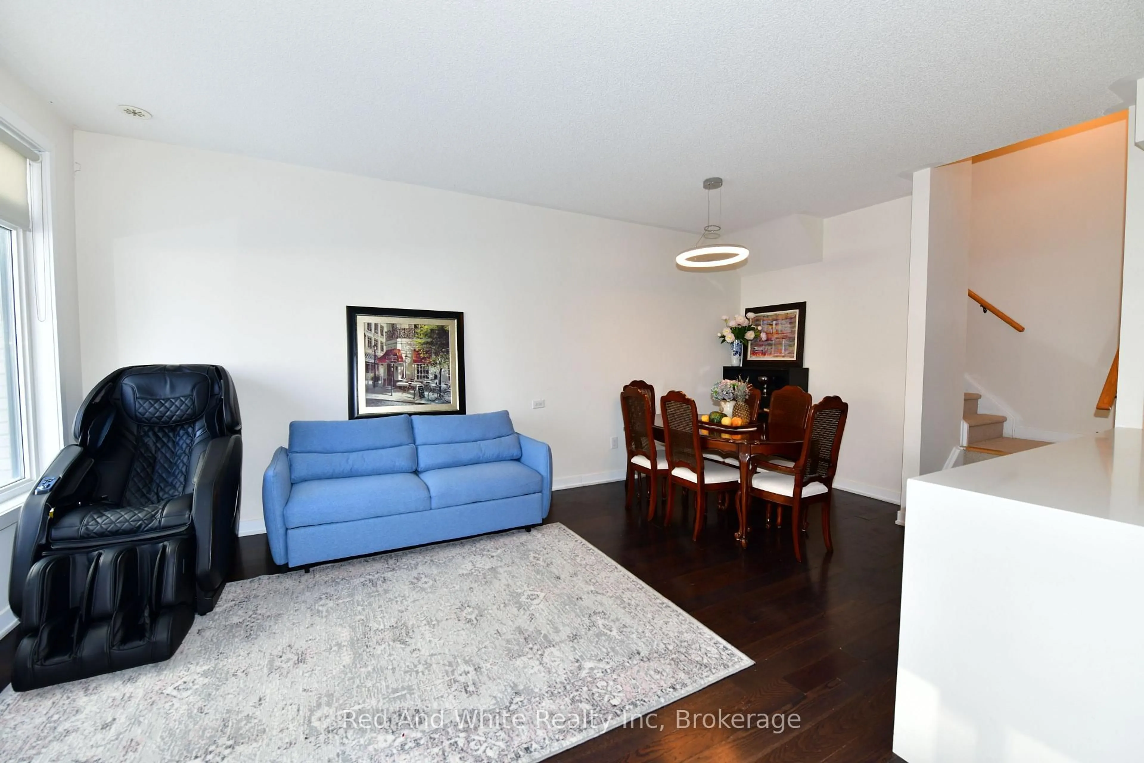 Living room with furniture, wood/laminate floor for 4080 Parkside Village Dr #3, Mississauga Ontario L5B 0K2