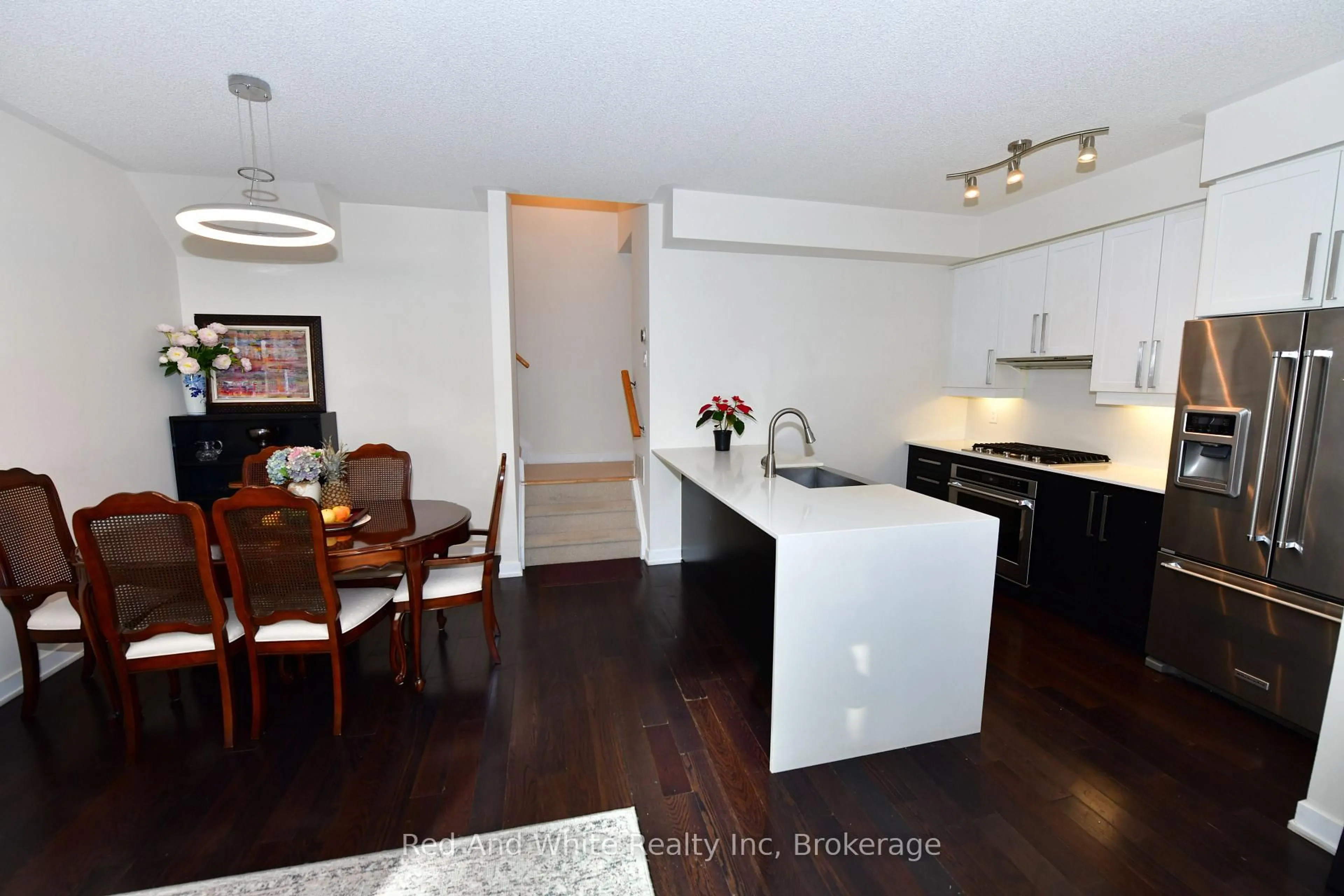 Open concept kitchen, wood/laminate floor for 4080 Parkside Village Dr #3, Mississauga Ontario L5B 0K2