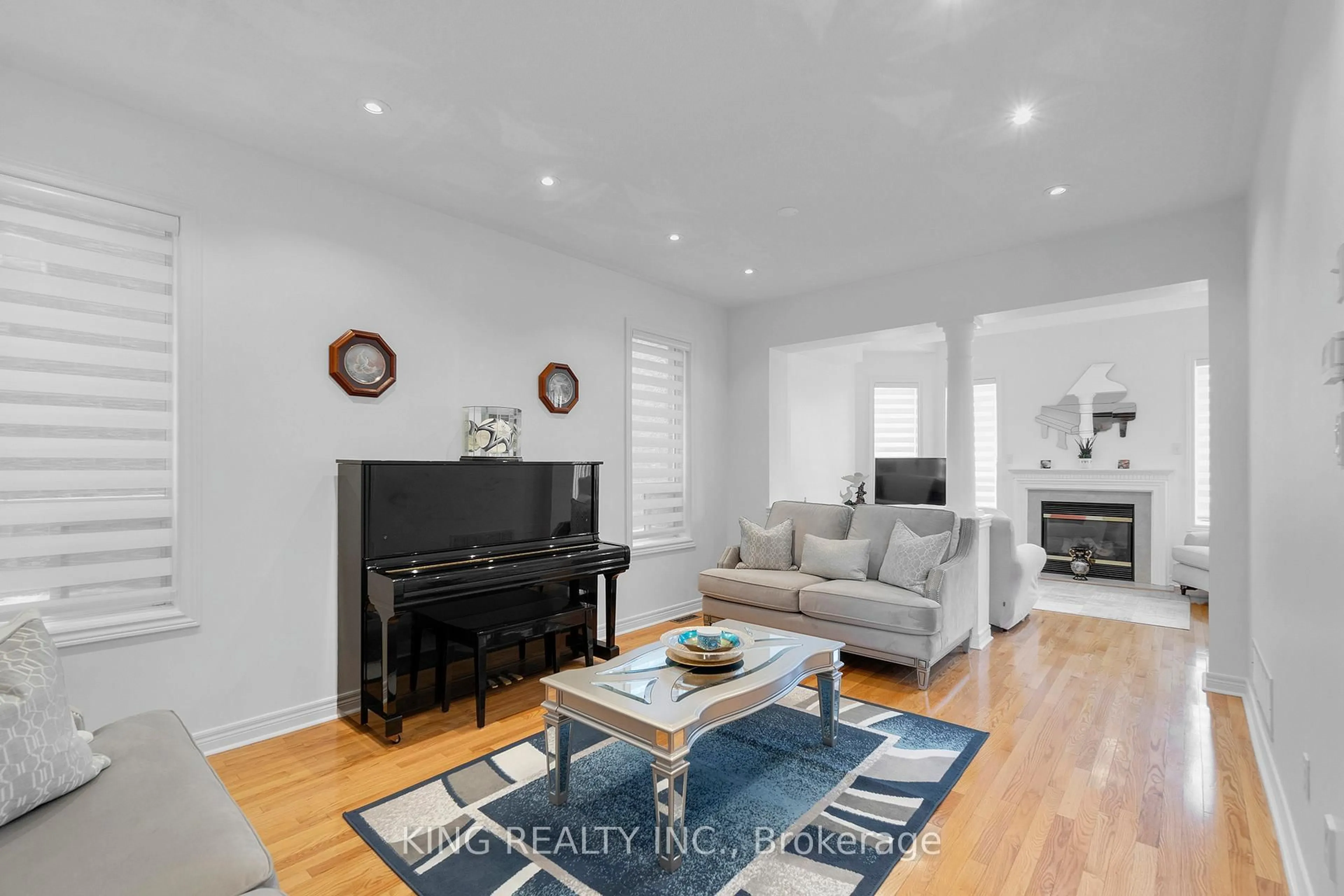 Living room with furniture, wood/laminate floor for 66 Saffron Cres, Brampton Ontario L6S 6H7