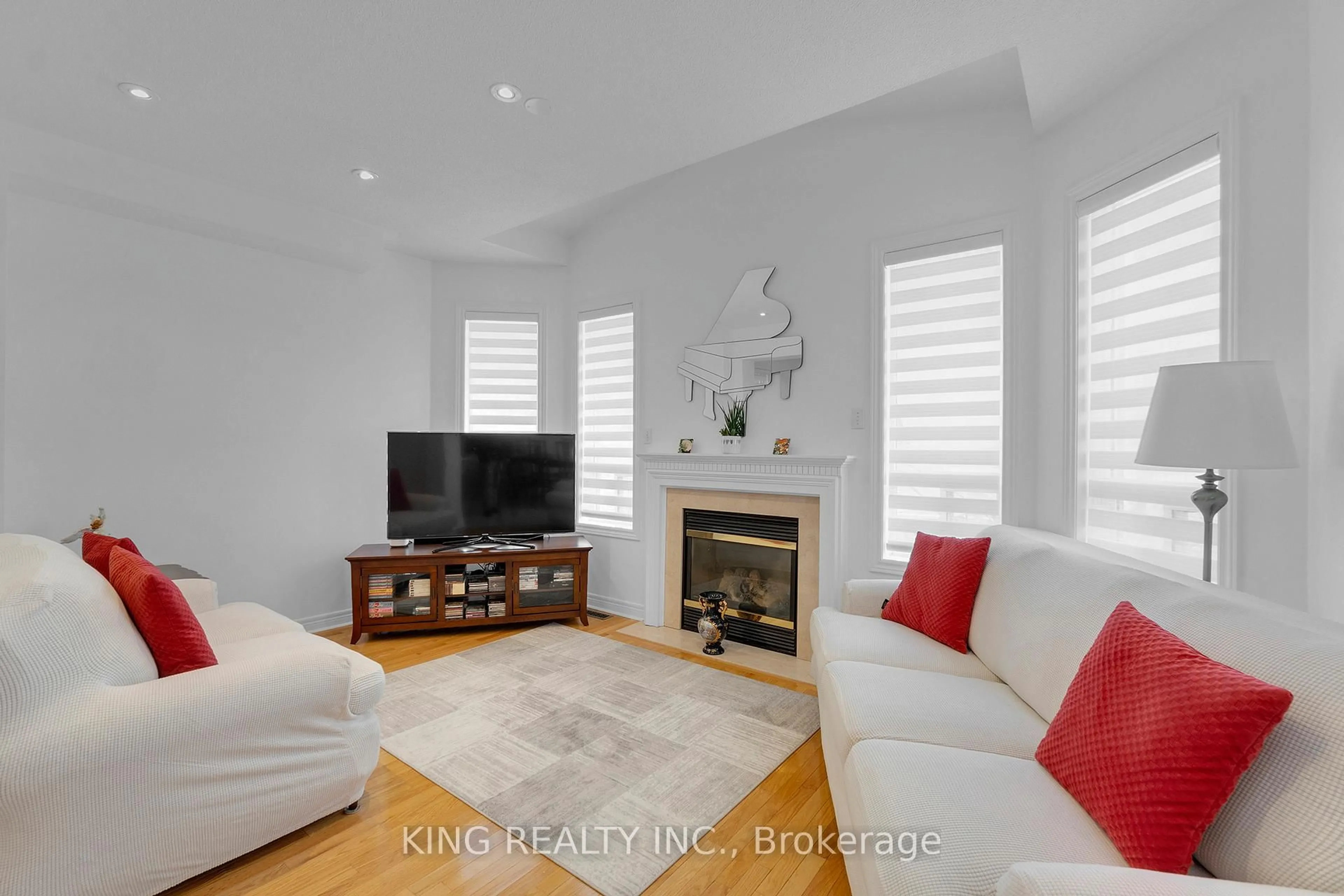 Living room with furniture, wood/laminate floor for 66 Saffron Cres, Brampton Ontario L6S 6H7