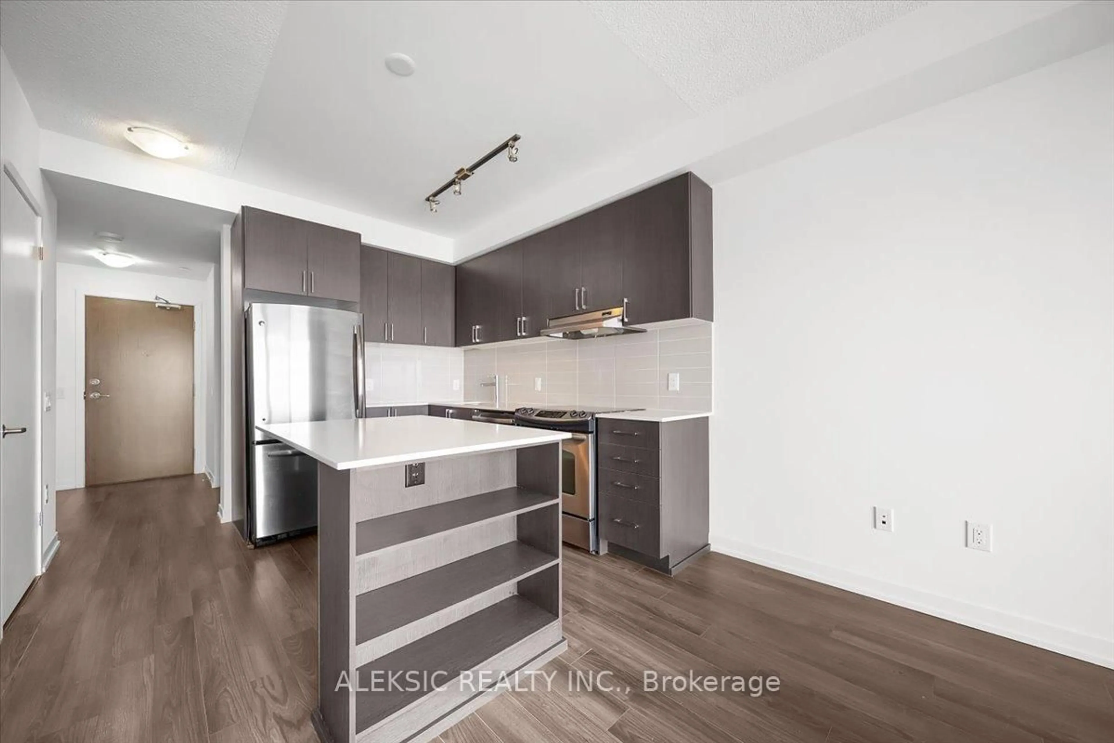 Open concept kitchen, wood/laminate floor for 2560 Eglinton Ave #2203, Mississauga Ontario L5M 0Y3