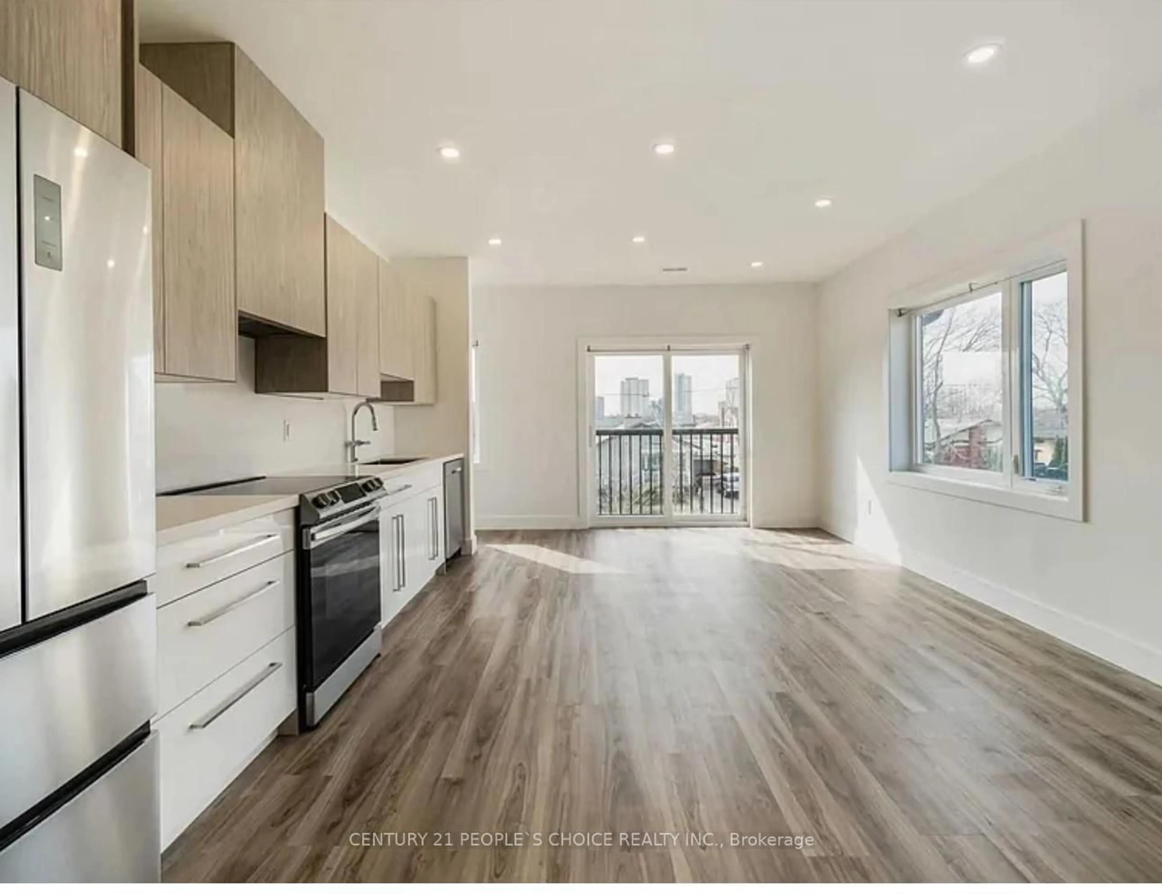 Open concept kitchen, wood/laminate floor for 54 Westhampton Dr, Toronto Ontario M9R 1X6