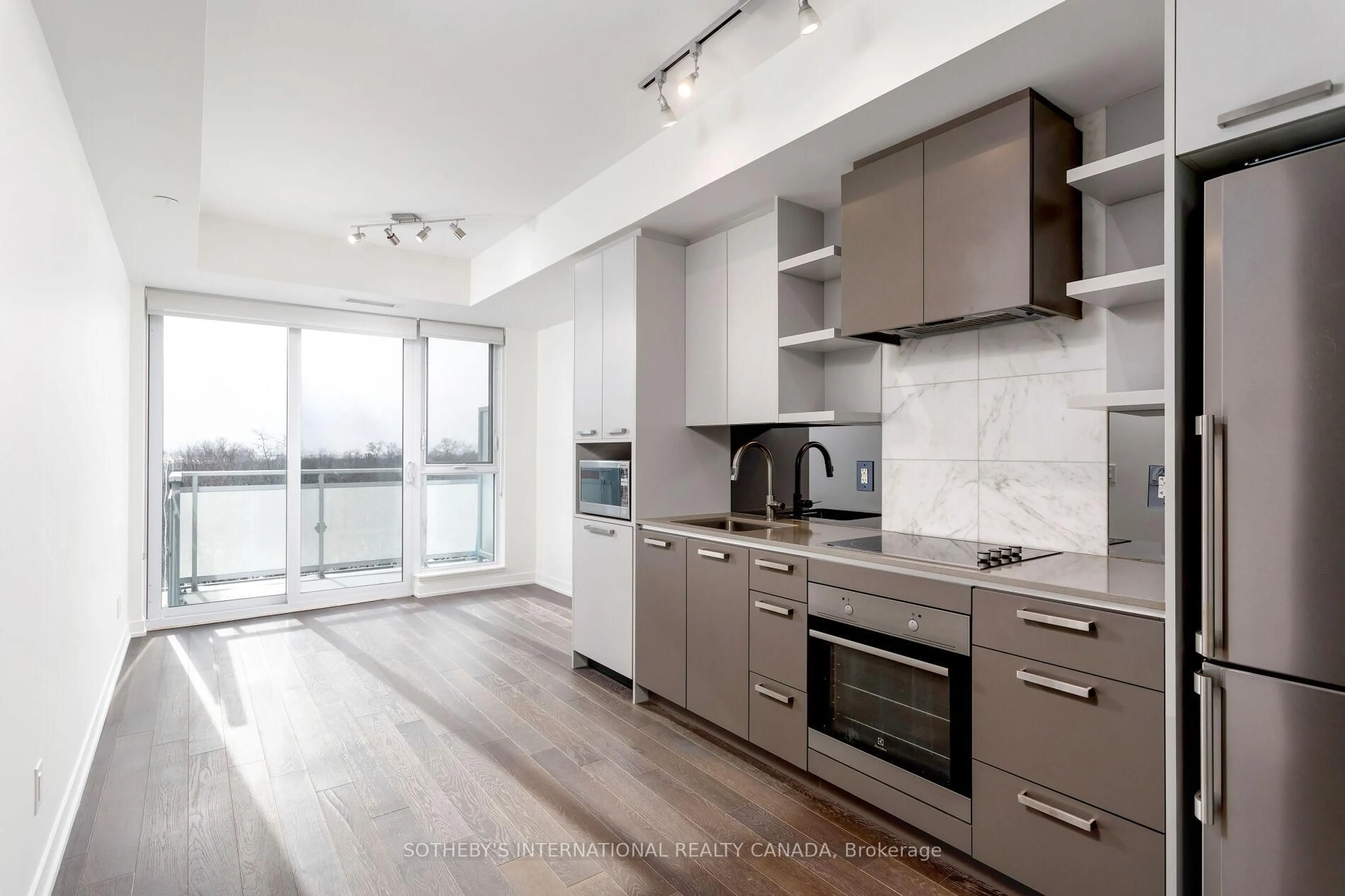 Open concept kitchen, wood/laminate floor for 1830 Bloor St #716, Toronto Ontario M6P 0A2