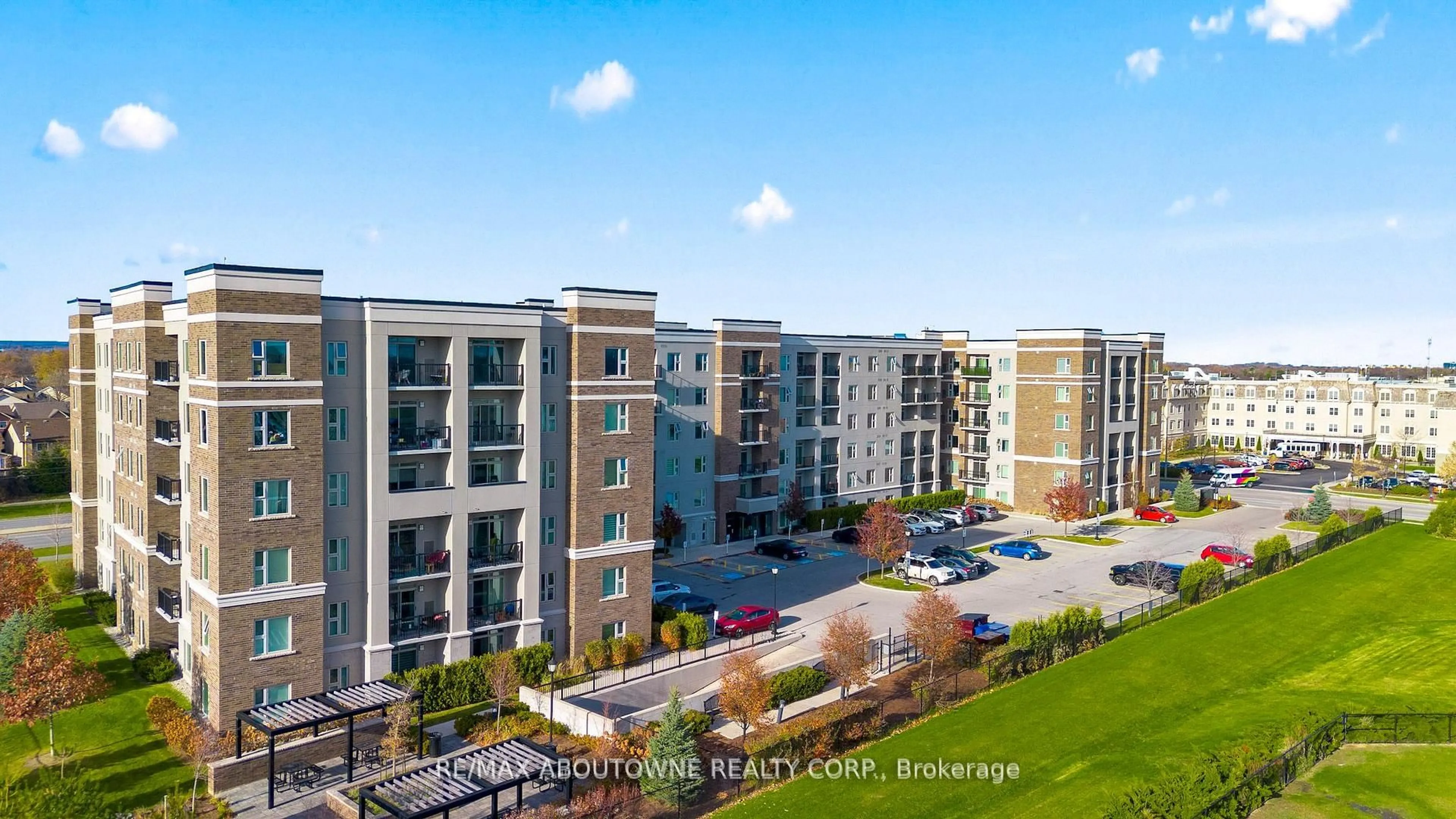 A pic from outside/outdoor area/front of a property/back of a property/a pic from drone, city buildings view from balcony for 610 Farmstead Dr #304, Milton Ontario L9T 7W2