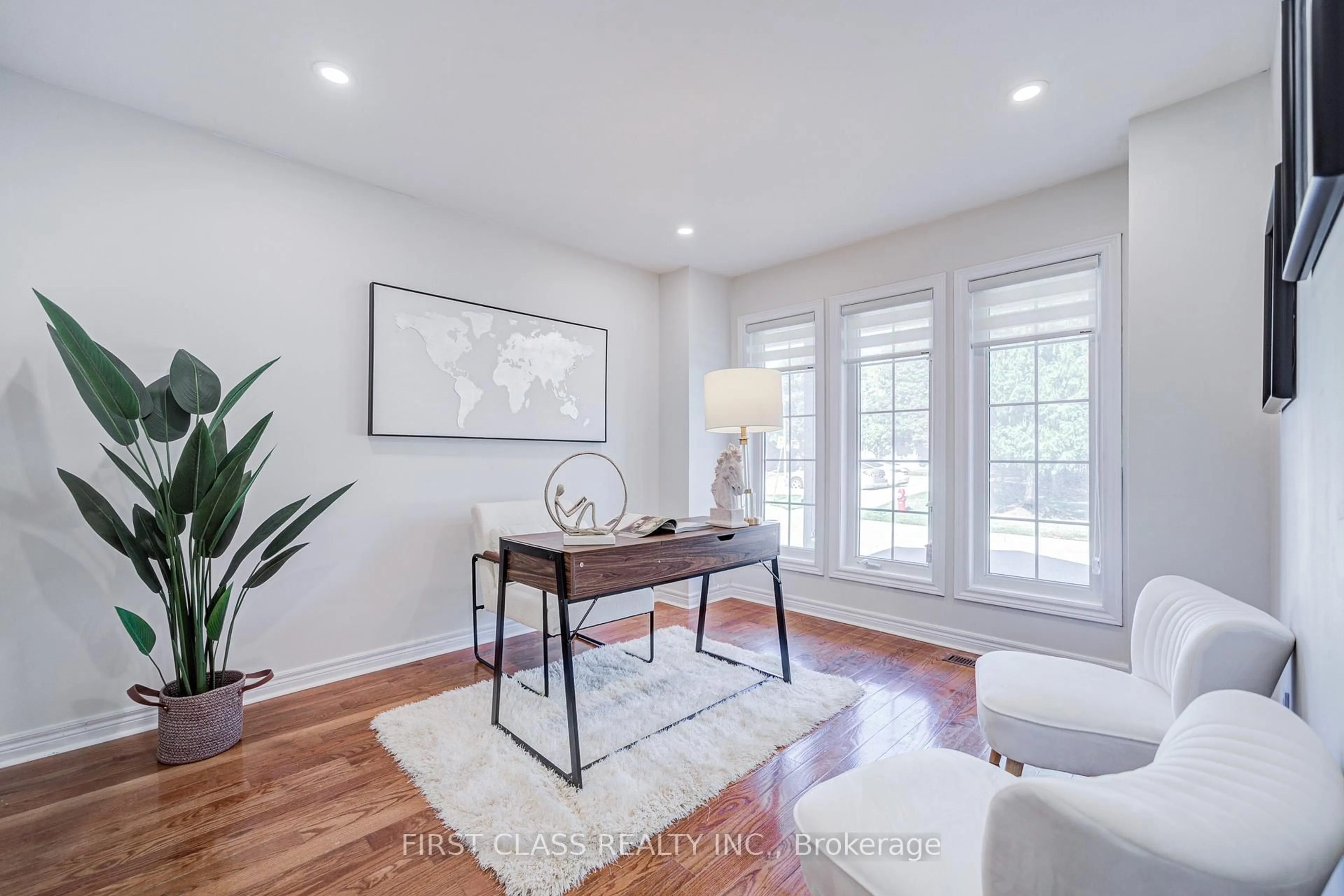 Living room with furniture, wood/laminate floor for 2665 Thomas St #59, Mississauga Ontario L5M 6G6