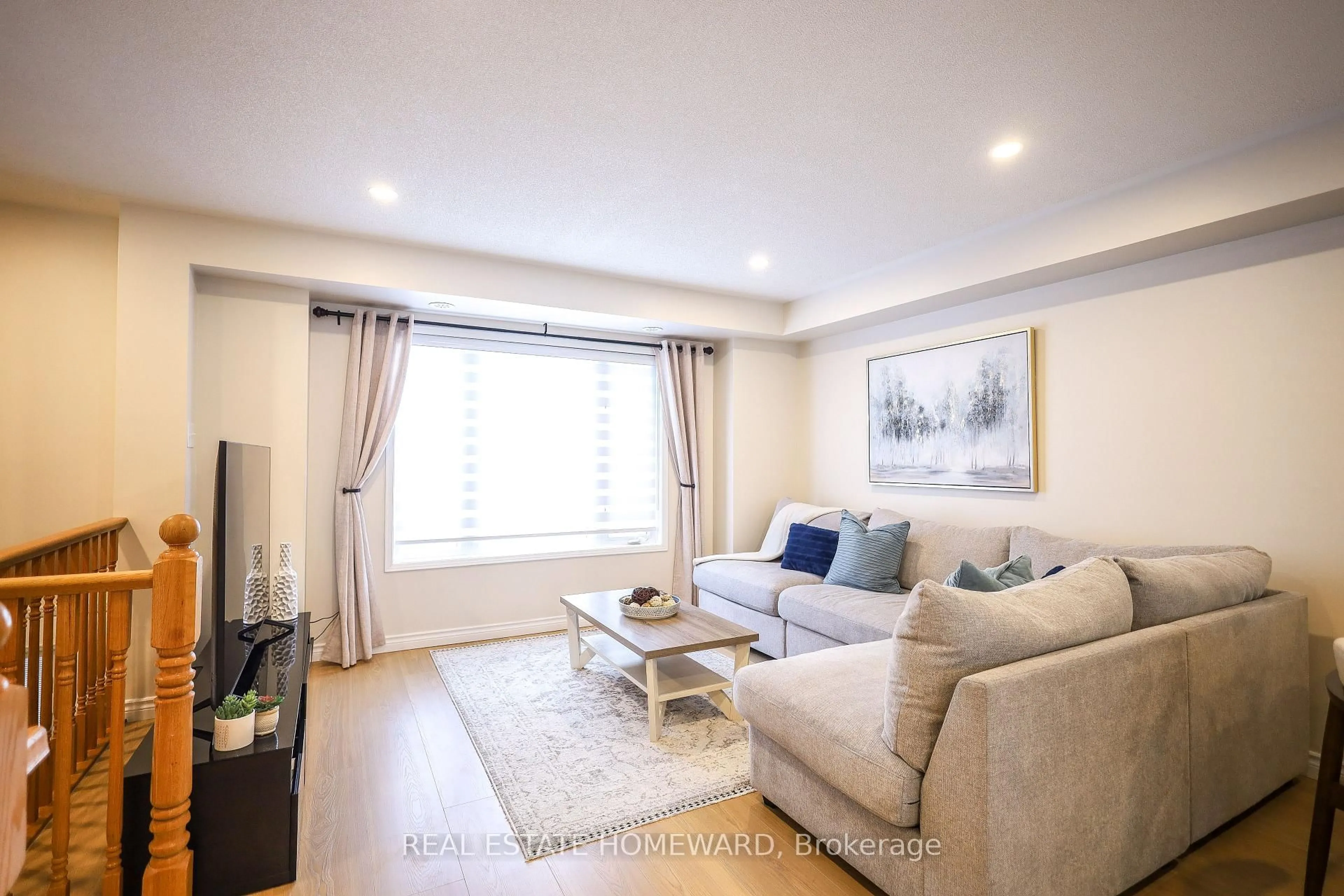 Living room with furniture, wood/laminate floor for 5650 Winston Churchill Blvd #51, Mississauga Ontario L5M 0L8