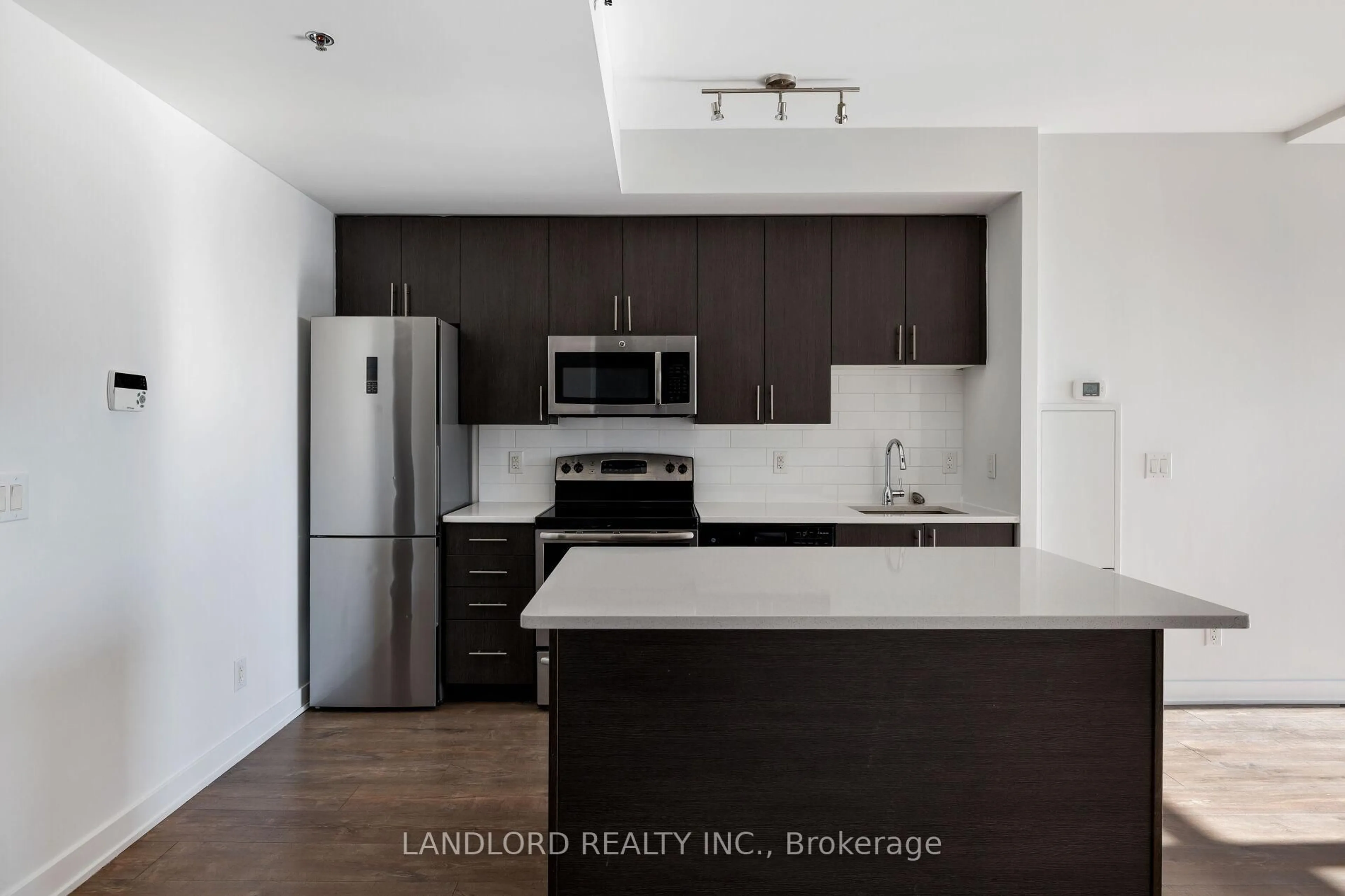 Standard kitchen, wood/laminate floor for 11 Superior Ave #905, Toronto Ontario M8V 0A7