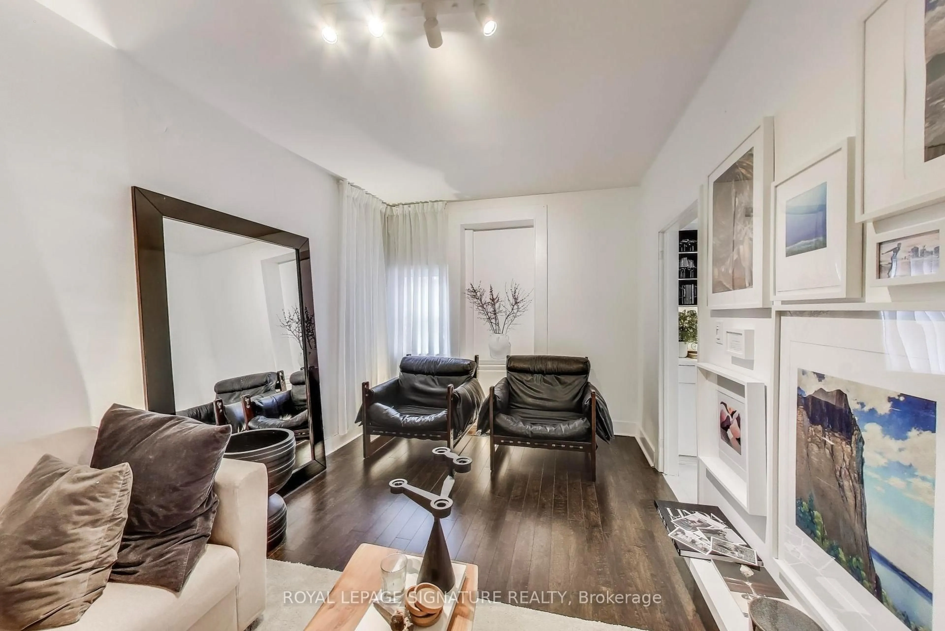 Living room with furniture, wood/laminate floor for 232 Pacific Ave, Toronto Ontario M6P 2P5