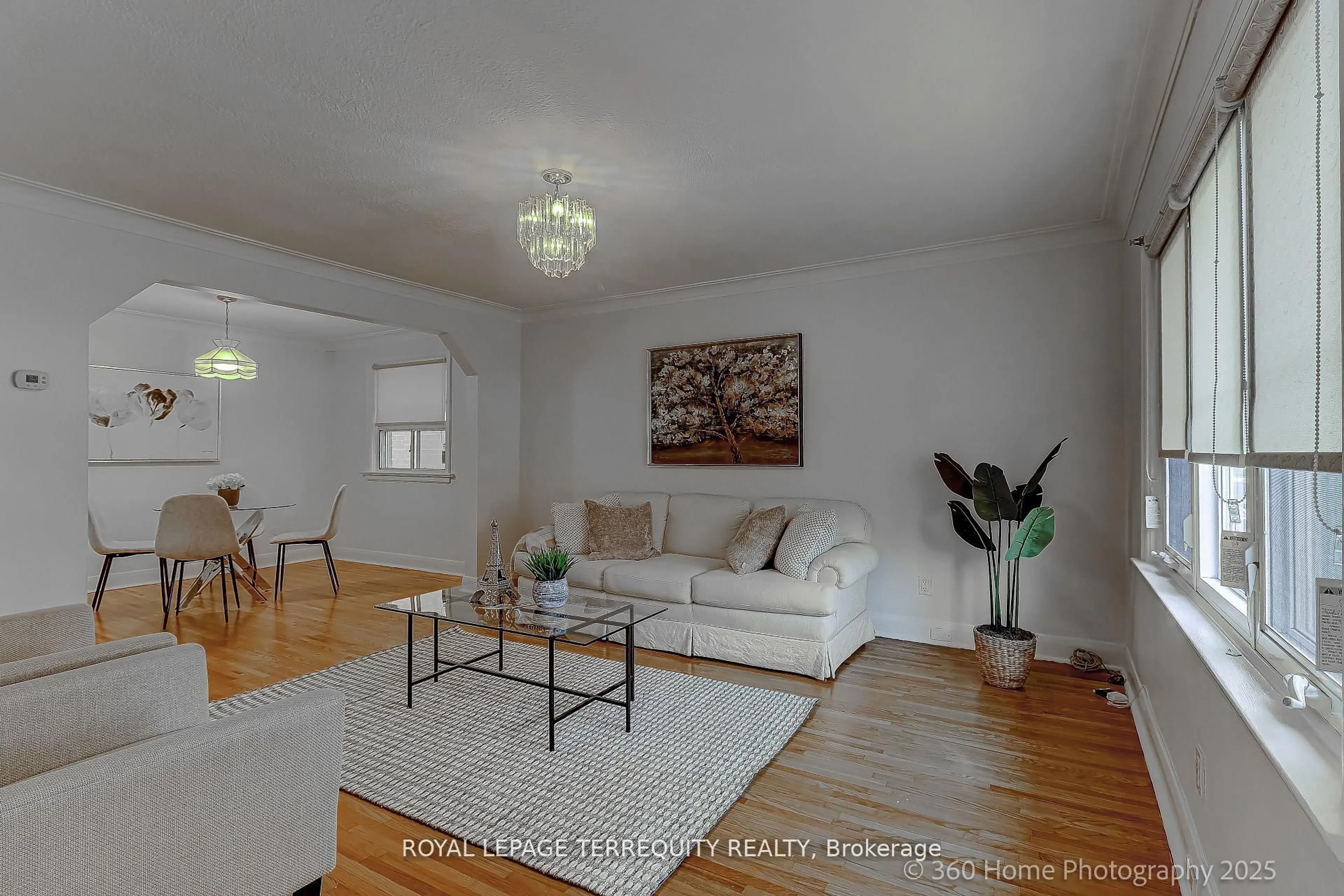 Living room with furniture, wood/laminate floor for 27 John Best Ave, Toronto Ontario M9N 1C4