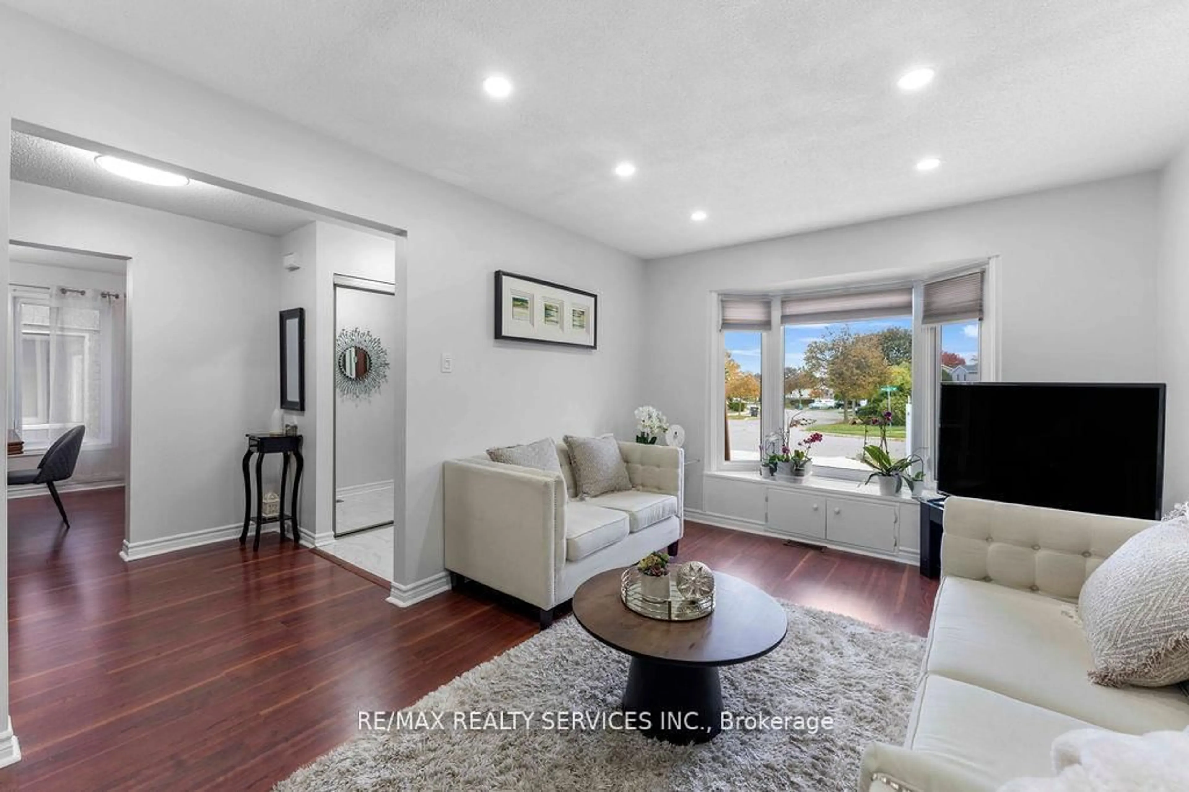 Living room with furniture, wood/laminate floor for 12 Nuttall St, Brampton Ontario L6S 4W3