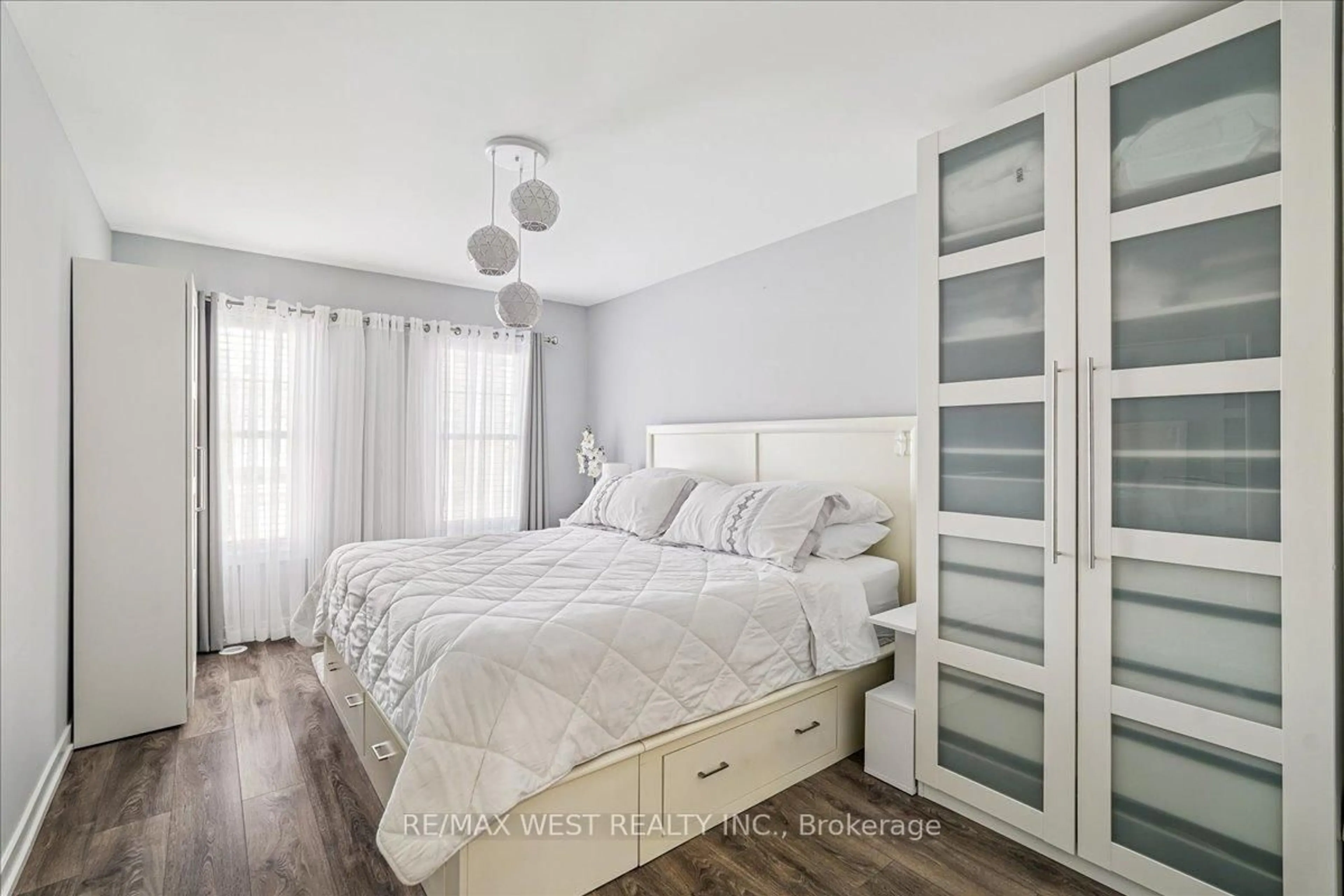 Bedroom with bed, wood/laminate floor for 80 Parrotta Dr #148, Toronto Ontario M9M 0E6