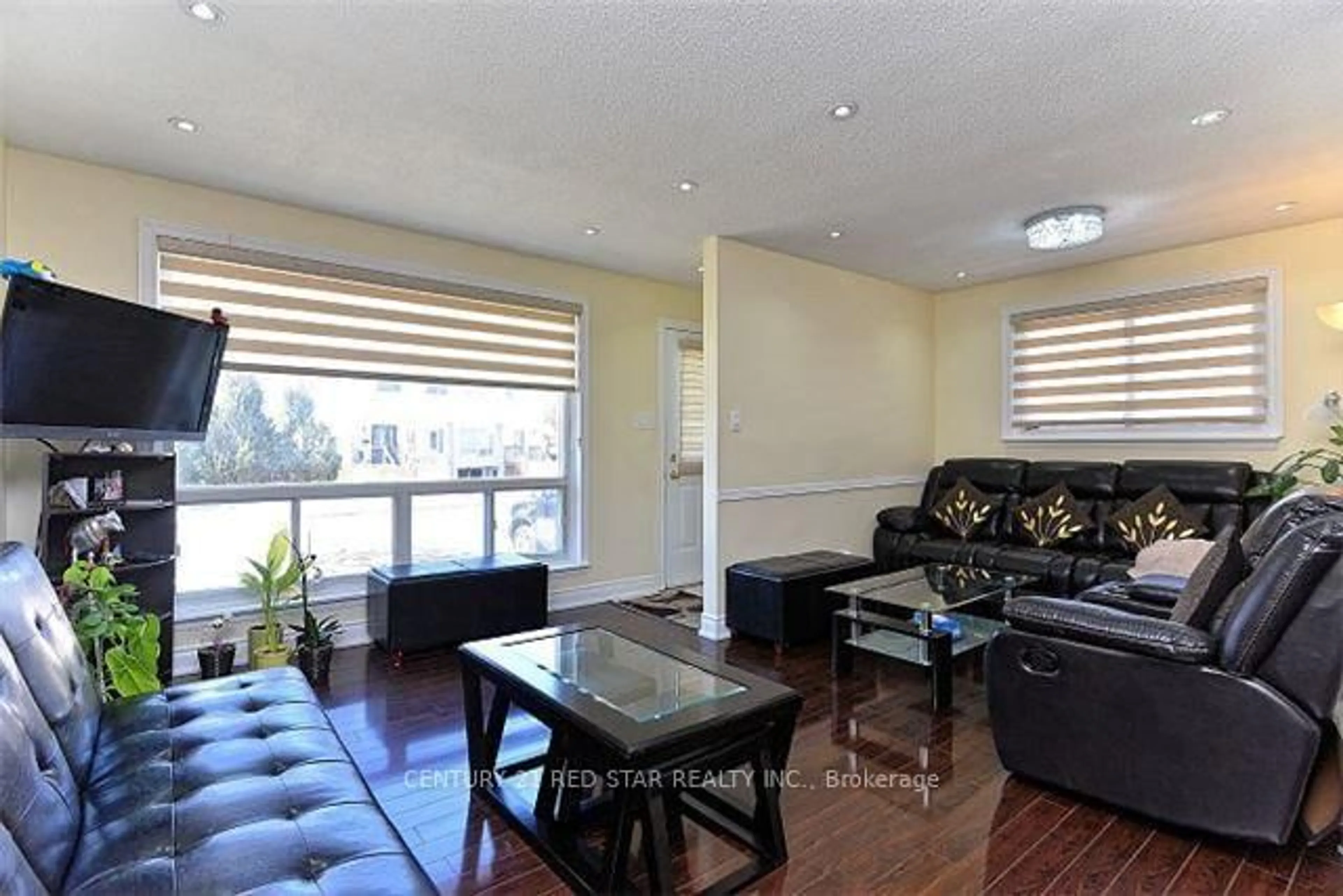 Living room with furniture, wood/laminate floor for 65 Newstead Cres, Brampton Ontario L6V 2A8