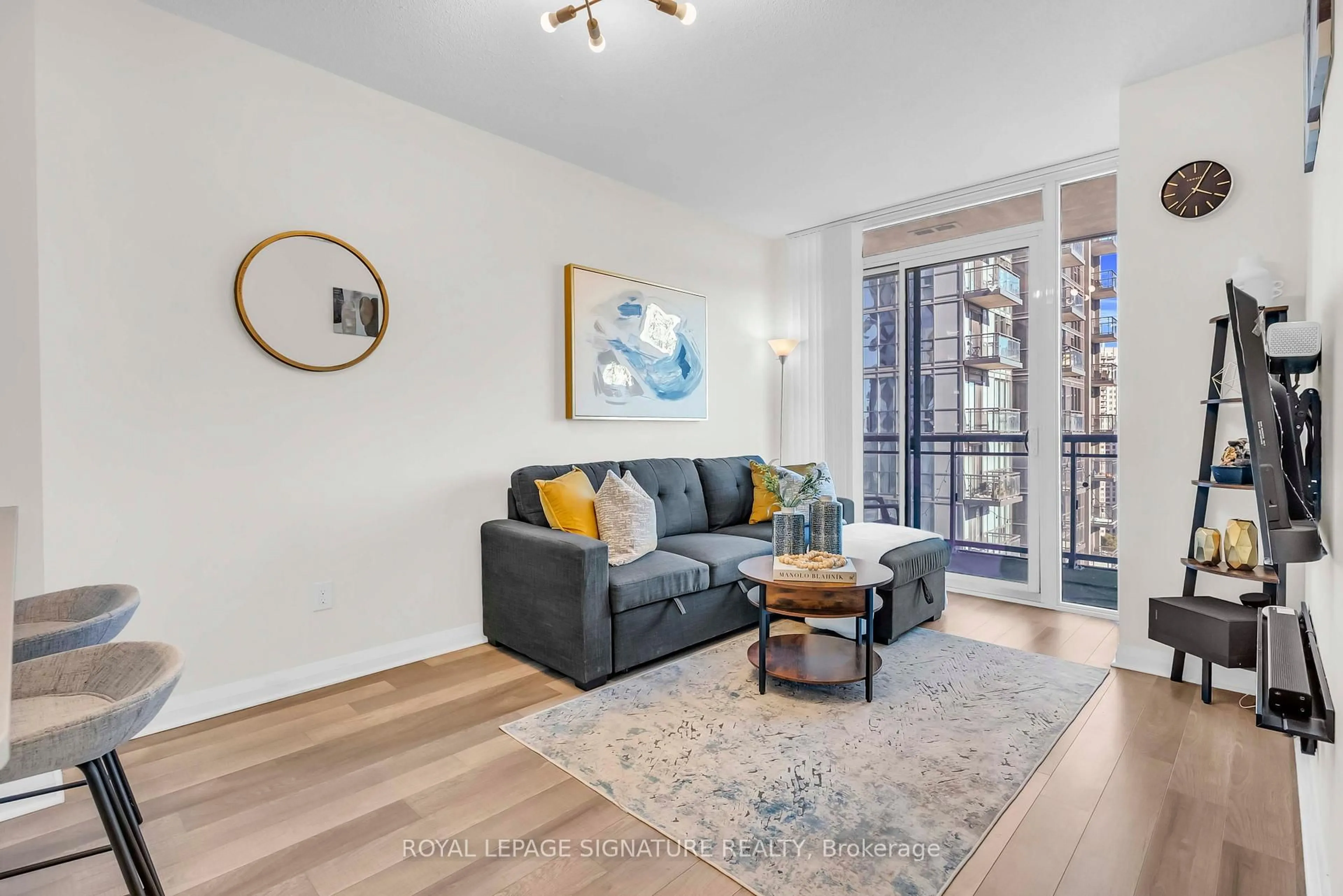 Living room with furniture, wood/laminate floor for 5033 Four Springs Ave #1811, Mississauga Ontario L5R 0G6