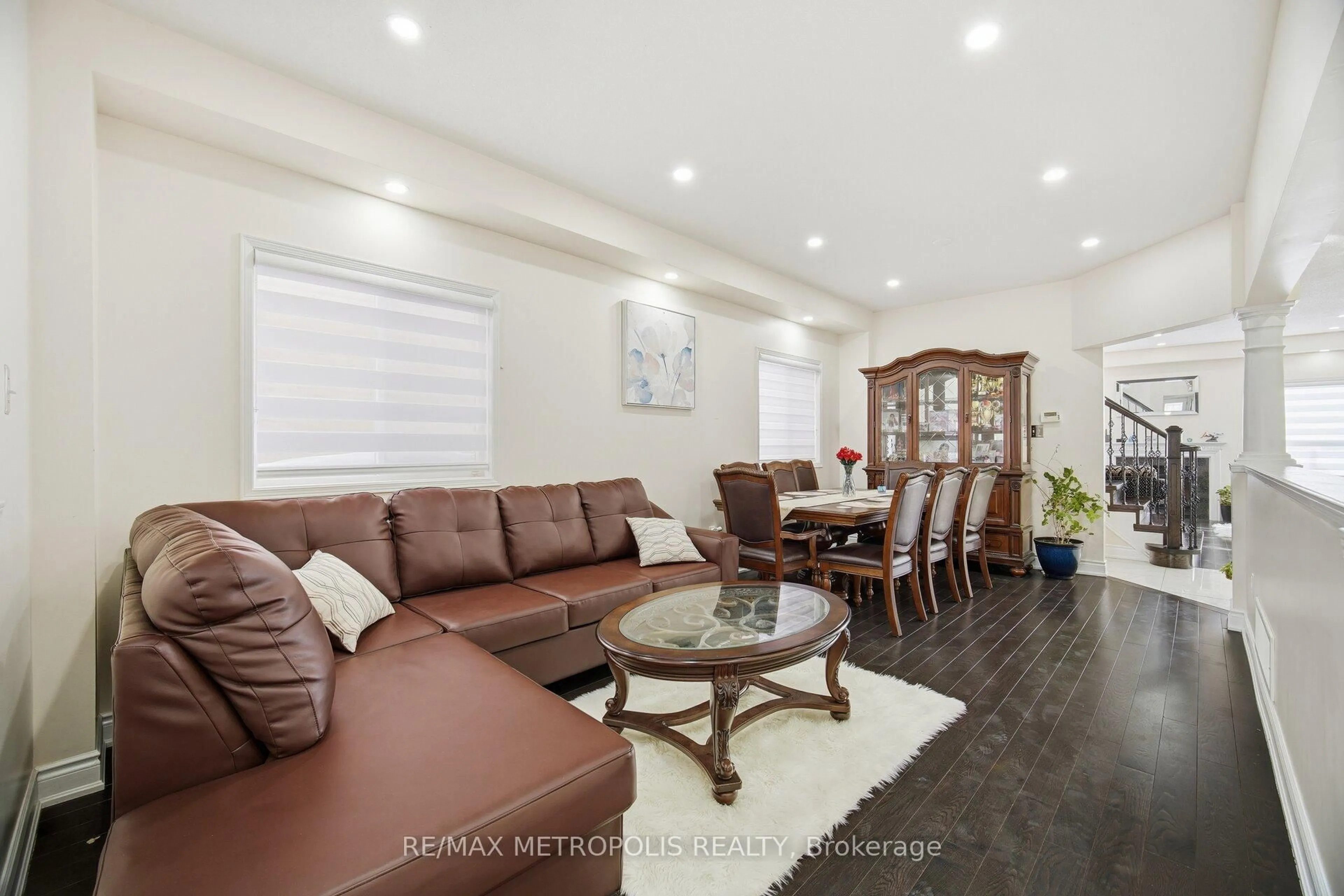 Living room with furniture, wood/laminate floor for 43 El Camino Way, Brampton Ontario L7A 3C4