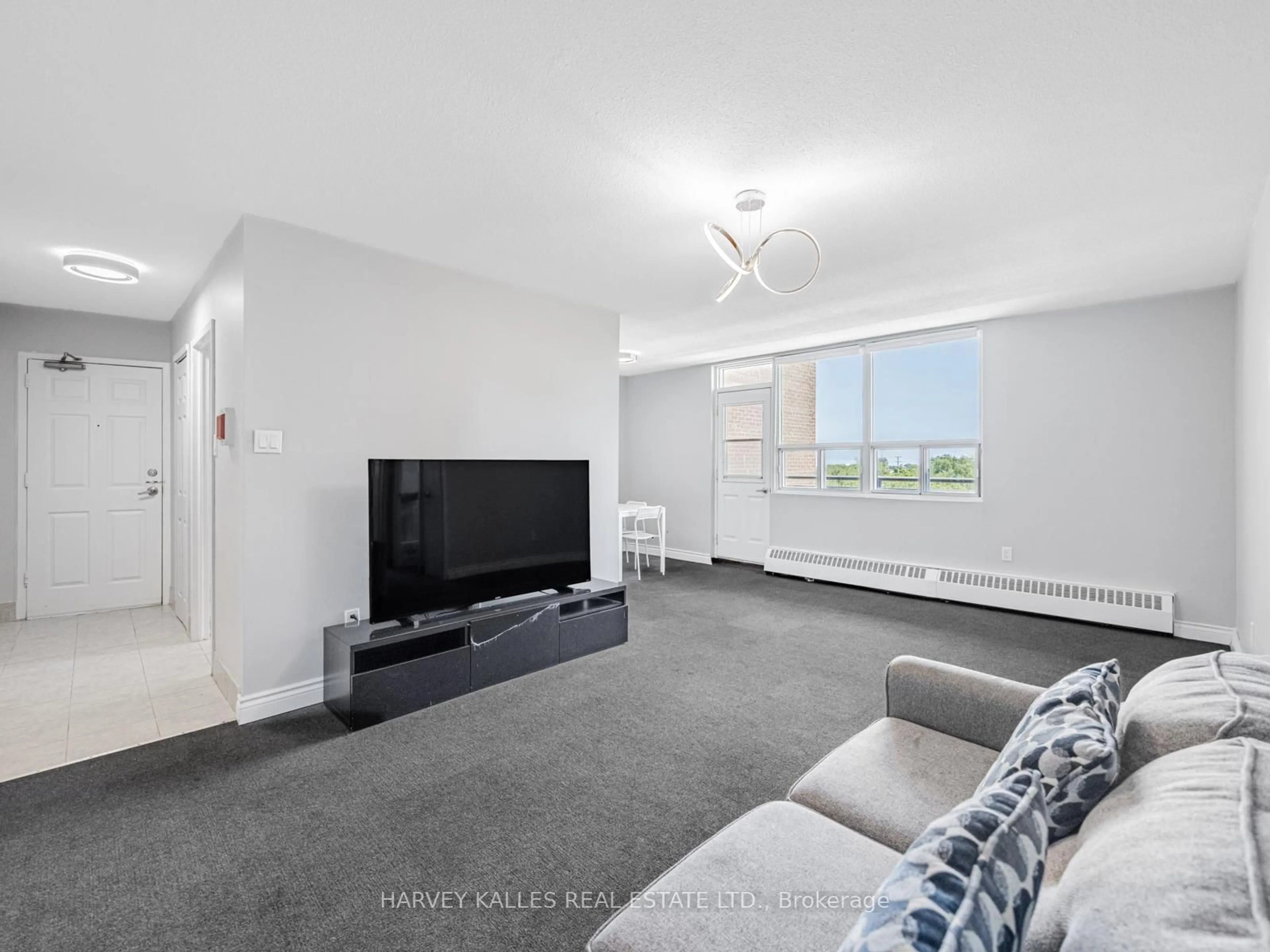 Living room with furniture, unknown for 3065 Queen Frederica Dr #505, Mississauga Ontario L4Y 3A3
