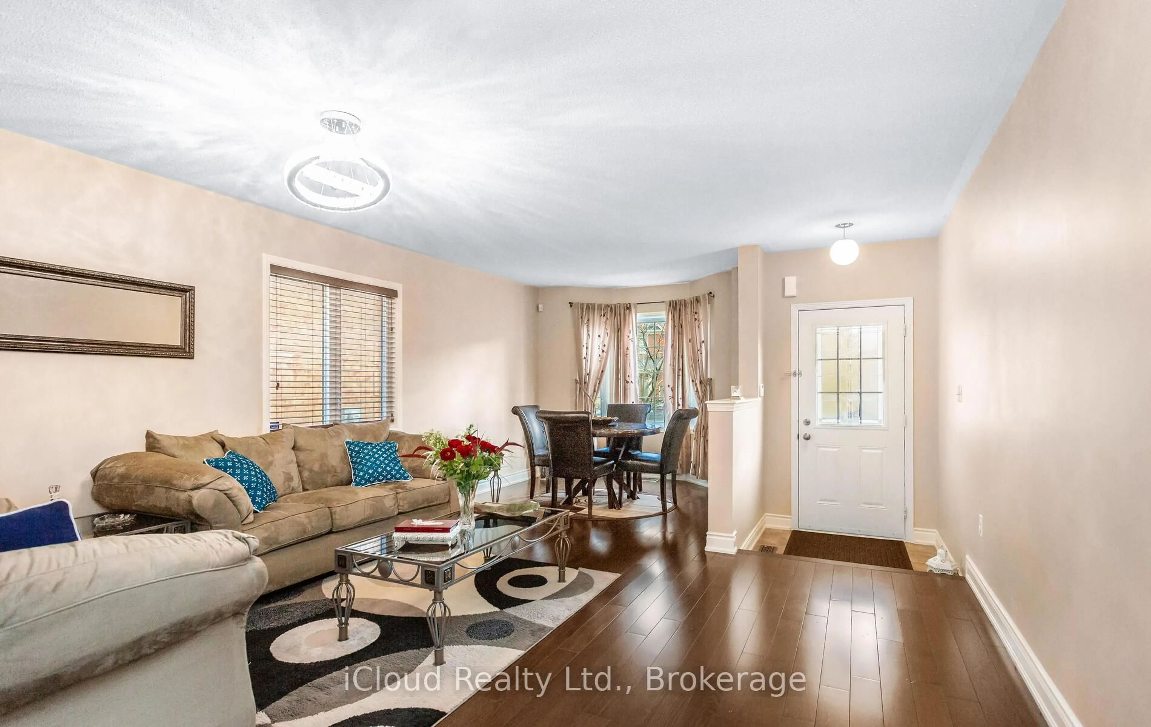 Living room with furniture, wood/laminate floor for 491 Landsborough Ave, Milton Ontario L9T 7X7