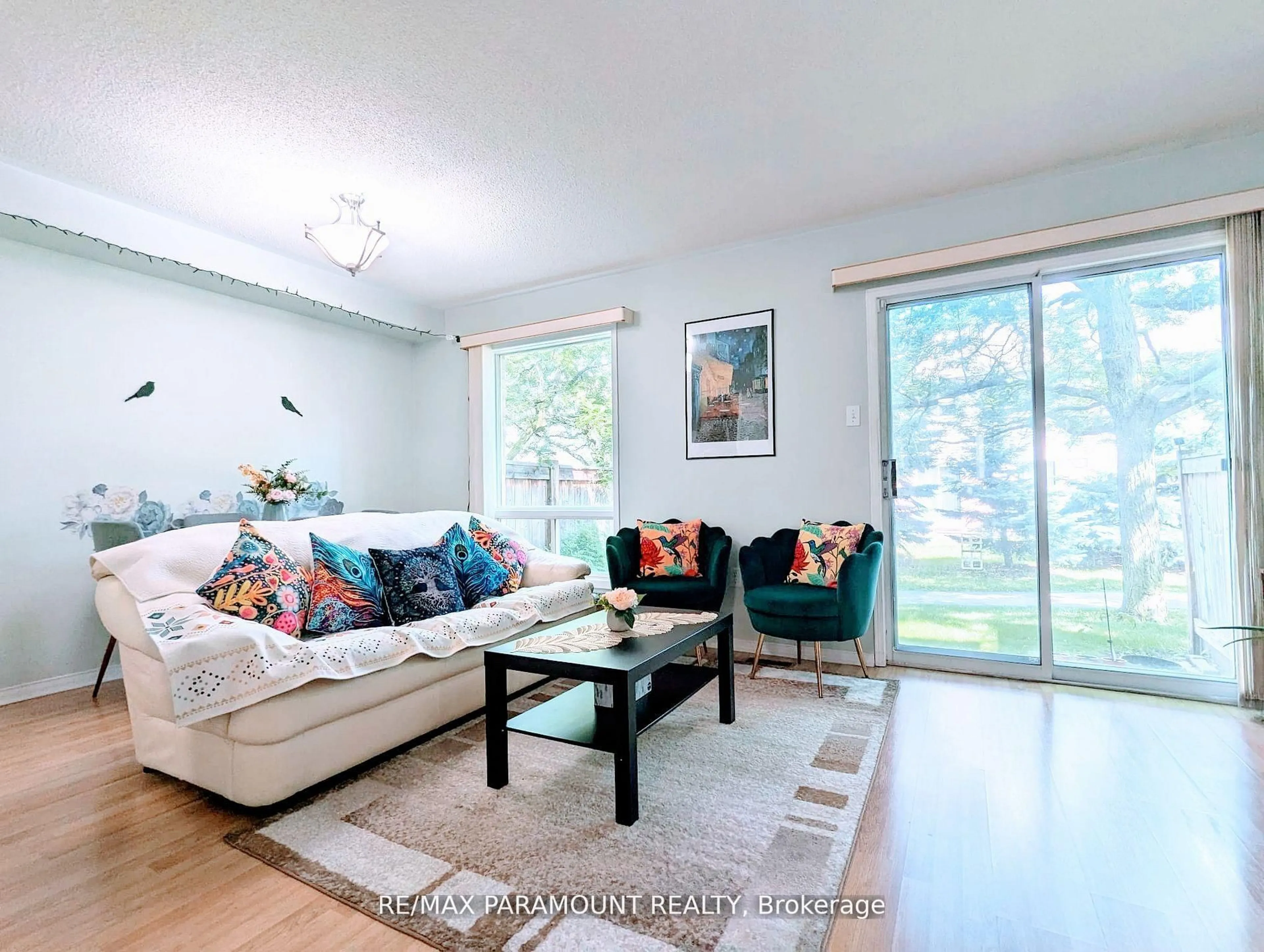 Living room with furniture, wood/laminate floor for 37 Wickstead Crt, Brampton Ontario L6R 1N8