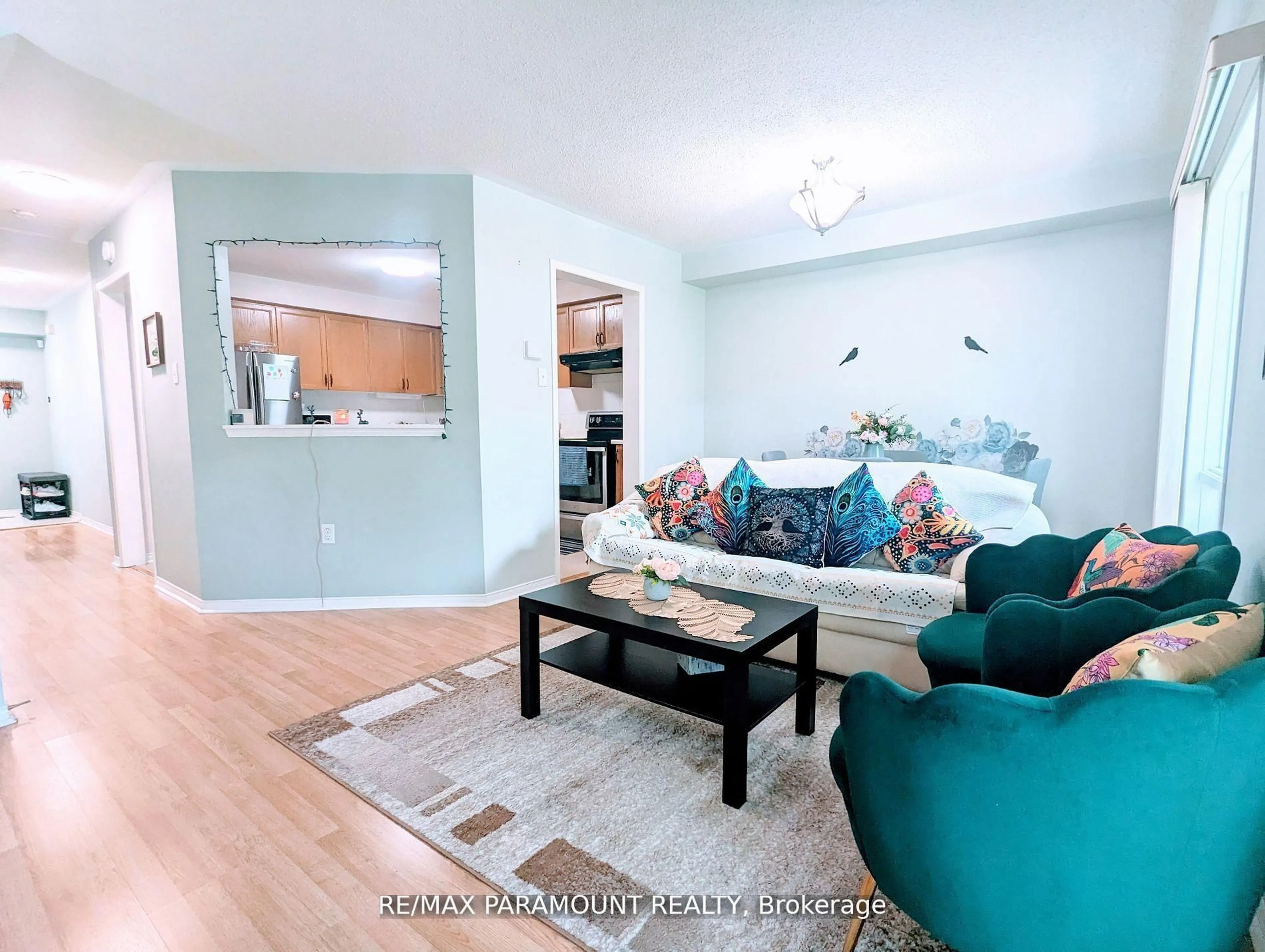 Living room with furniture, wood/laminate floor for 37 Wickstead Crt, Brampton Ontario L6R 1N8