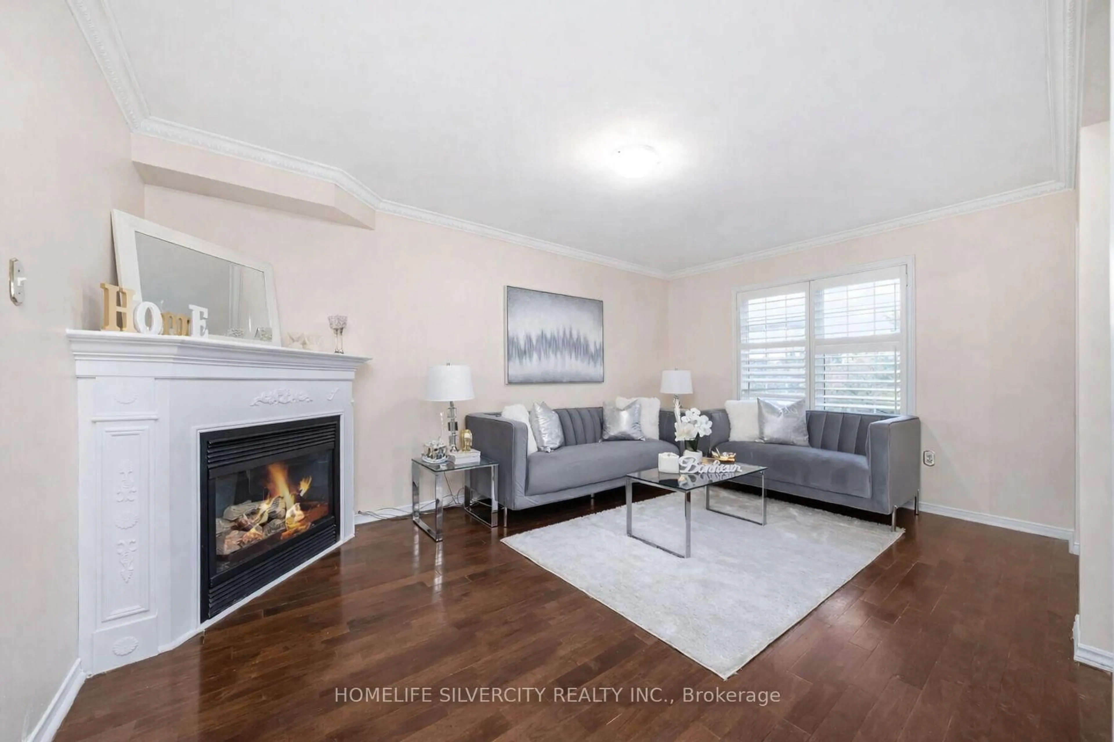 Living room with furniture, wood/laminate floor for 16 Coralreef Cres, Brampton Ontario L6R 2H5