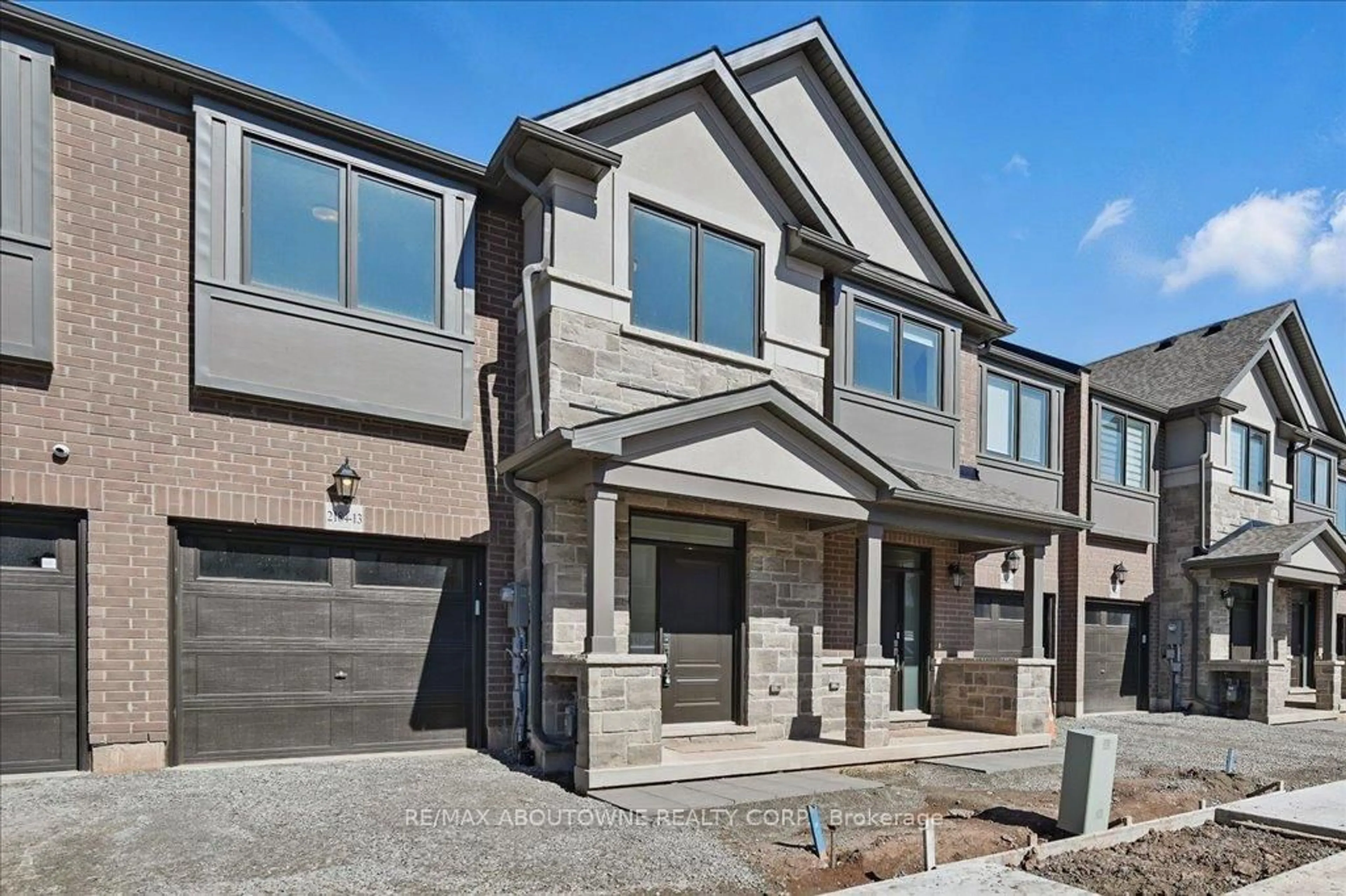 Home with brick exterior material, street for 2184 Postmaster Dr #13, Oakville Ontario L6M 3X1
