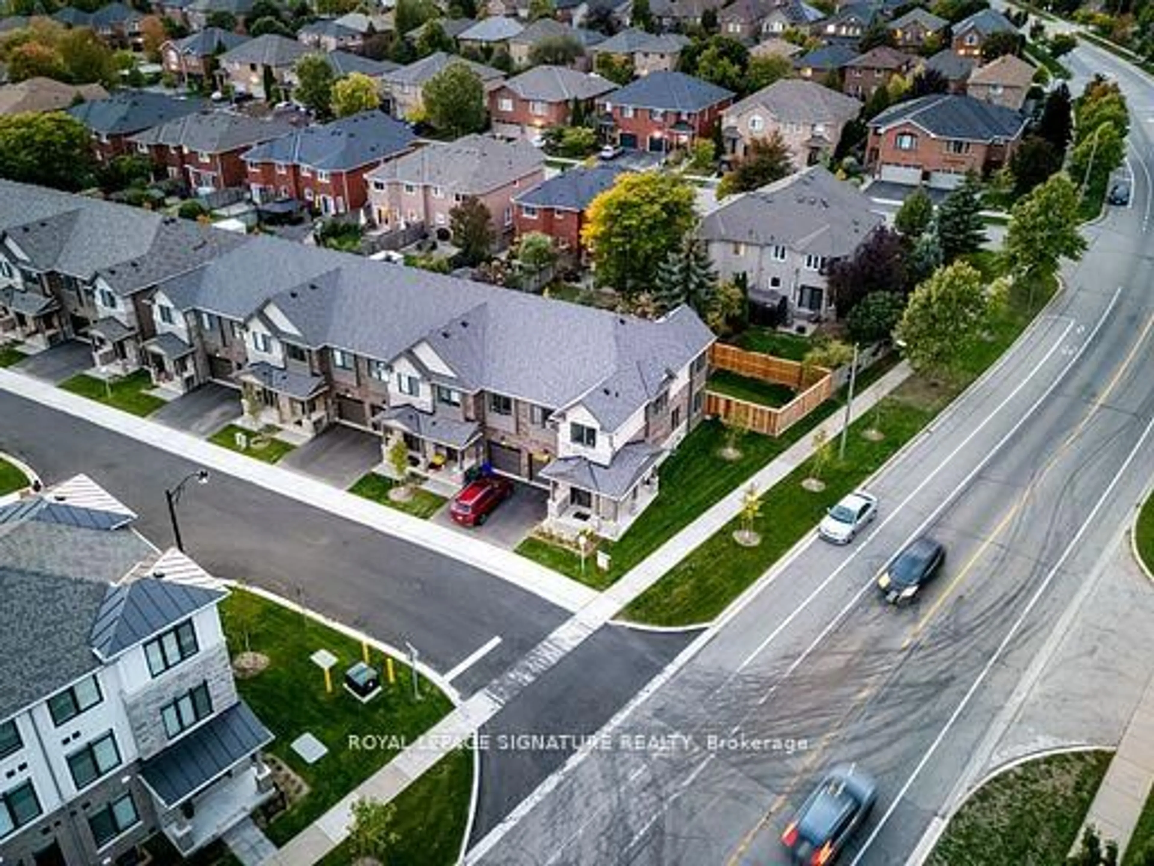 A pic from outside/outdoor area/front of a property/back of a property/a pic from drone, street for 2184 Postmaster Dr #1, Oakville Ontario L6M 3X1