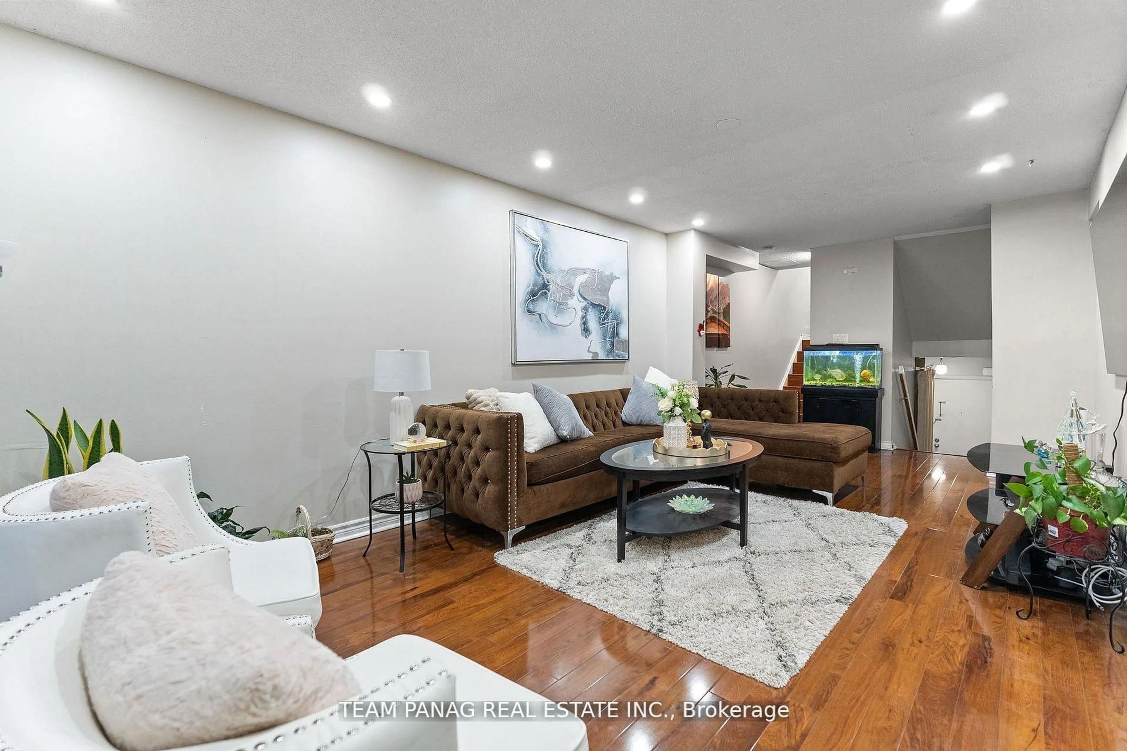 Living room with furniture, wood/laminate floor for 142 Ashurst Cres, Brampton Ontario L6V 3N9