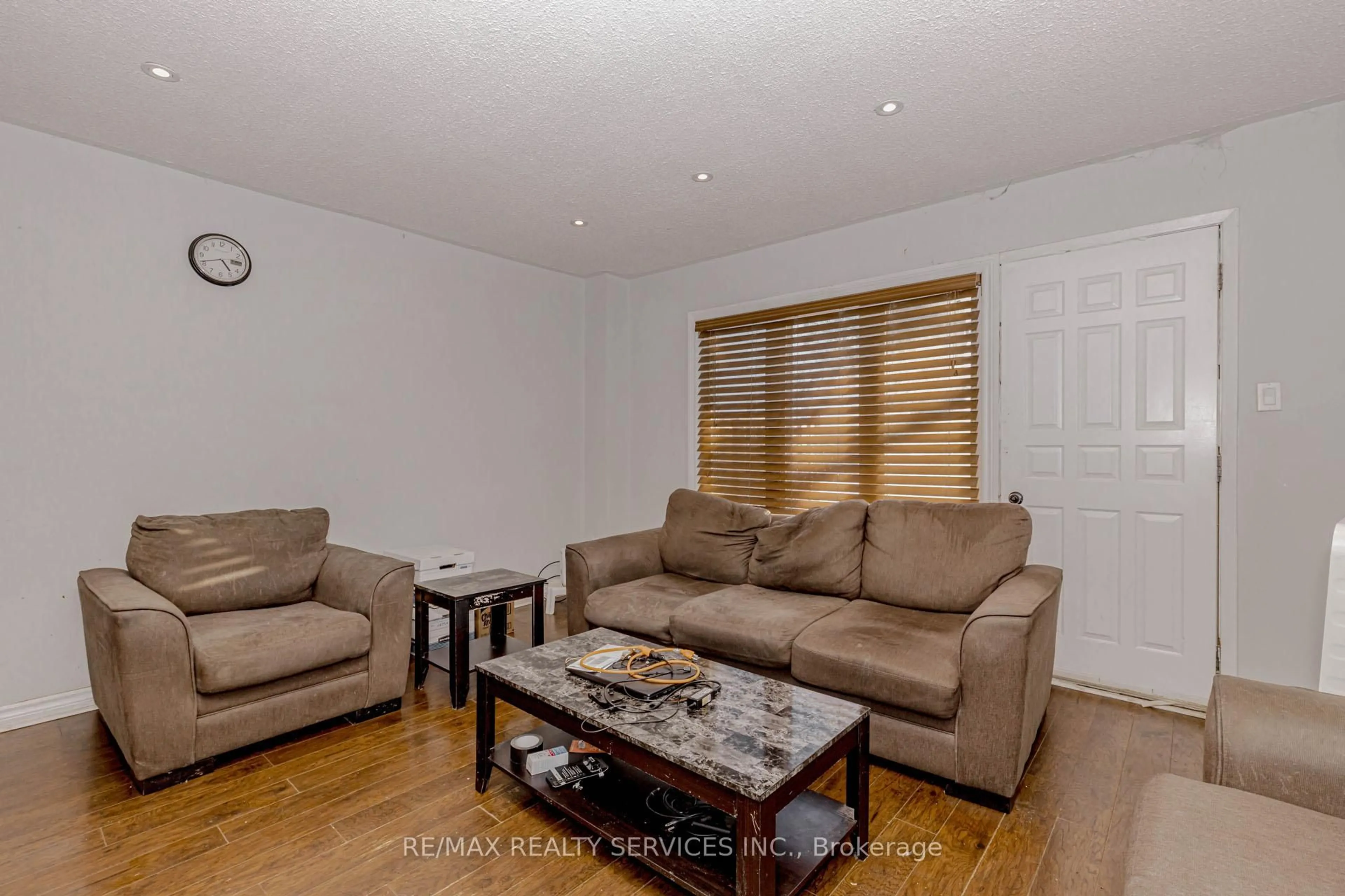 Living room with furniture, wood/laminate floor for 475 Bramalea Rd #117, Brampton Ontario L6T 2X3