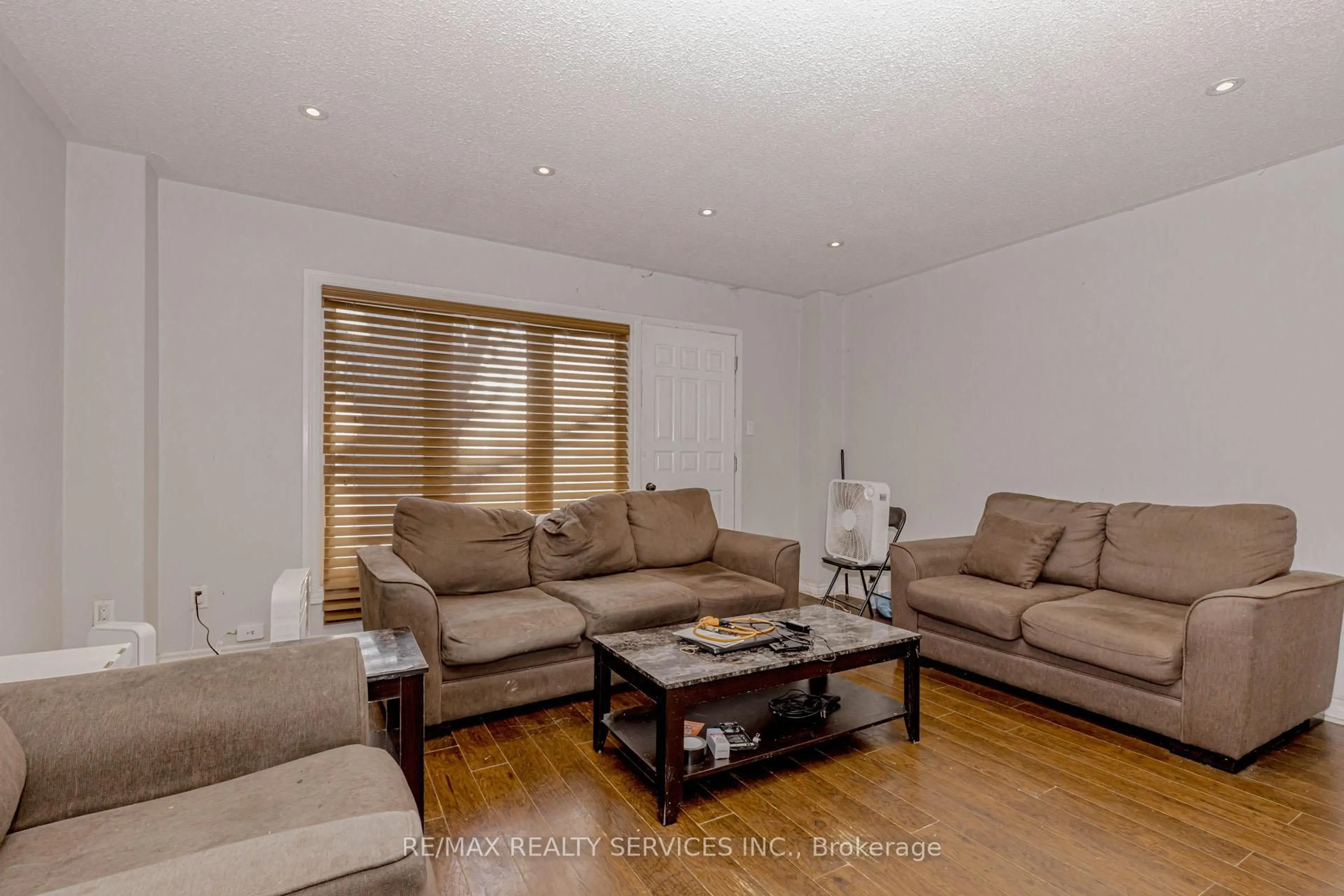 Living room with furniture, wood/laminate floor for 475 Bramalea Rd #117, Brampton Ontario L6T 2X3