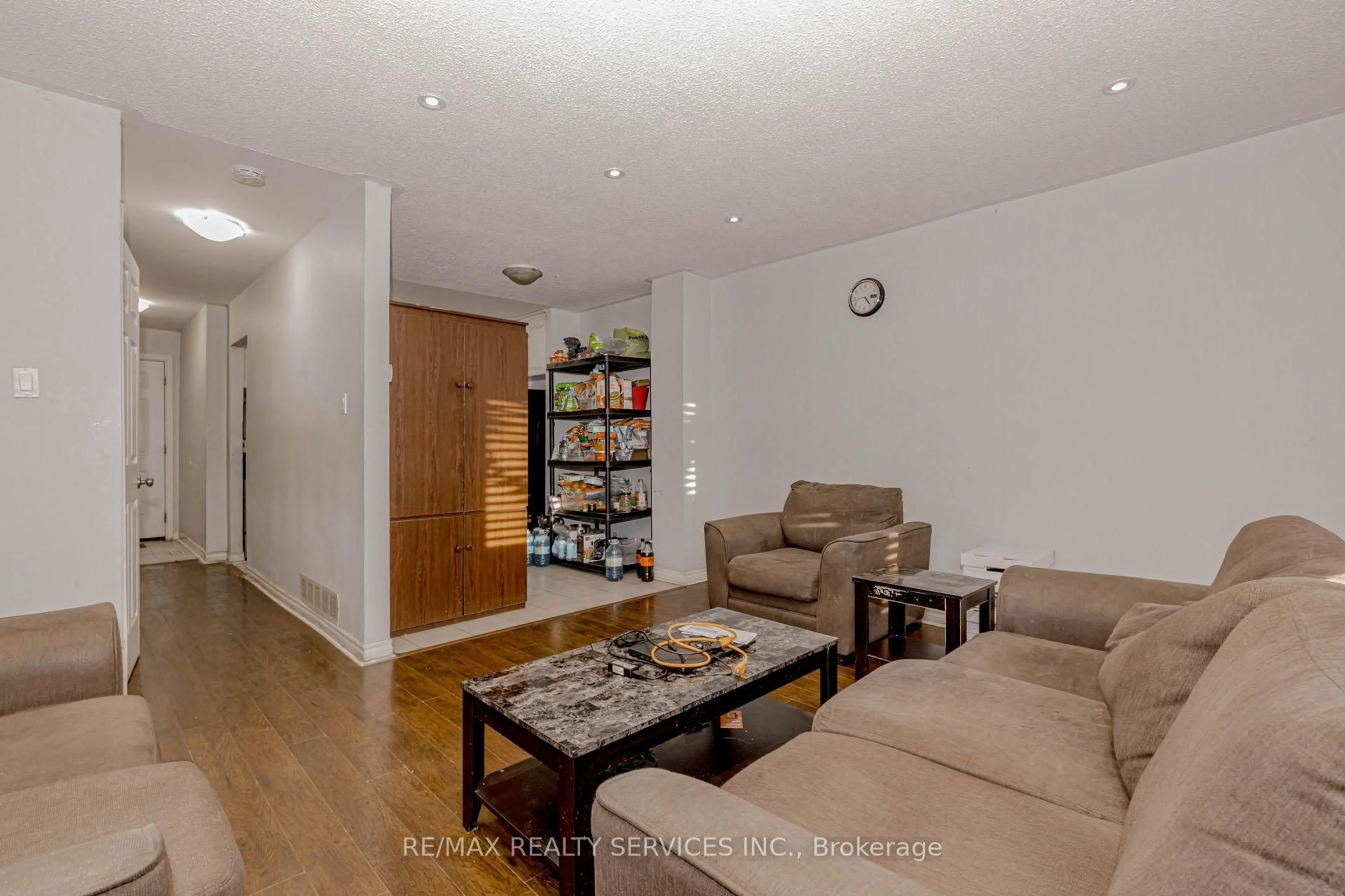 Living room with furniture, wood/laminate floor for 475 Bramalea Rd #117, Brampton Ontario L6T 2X3