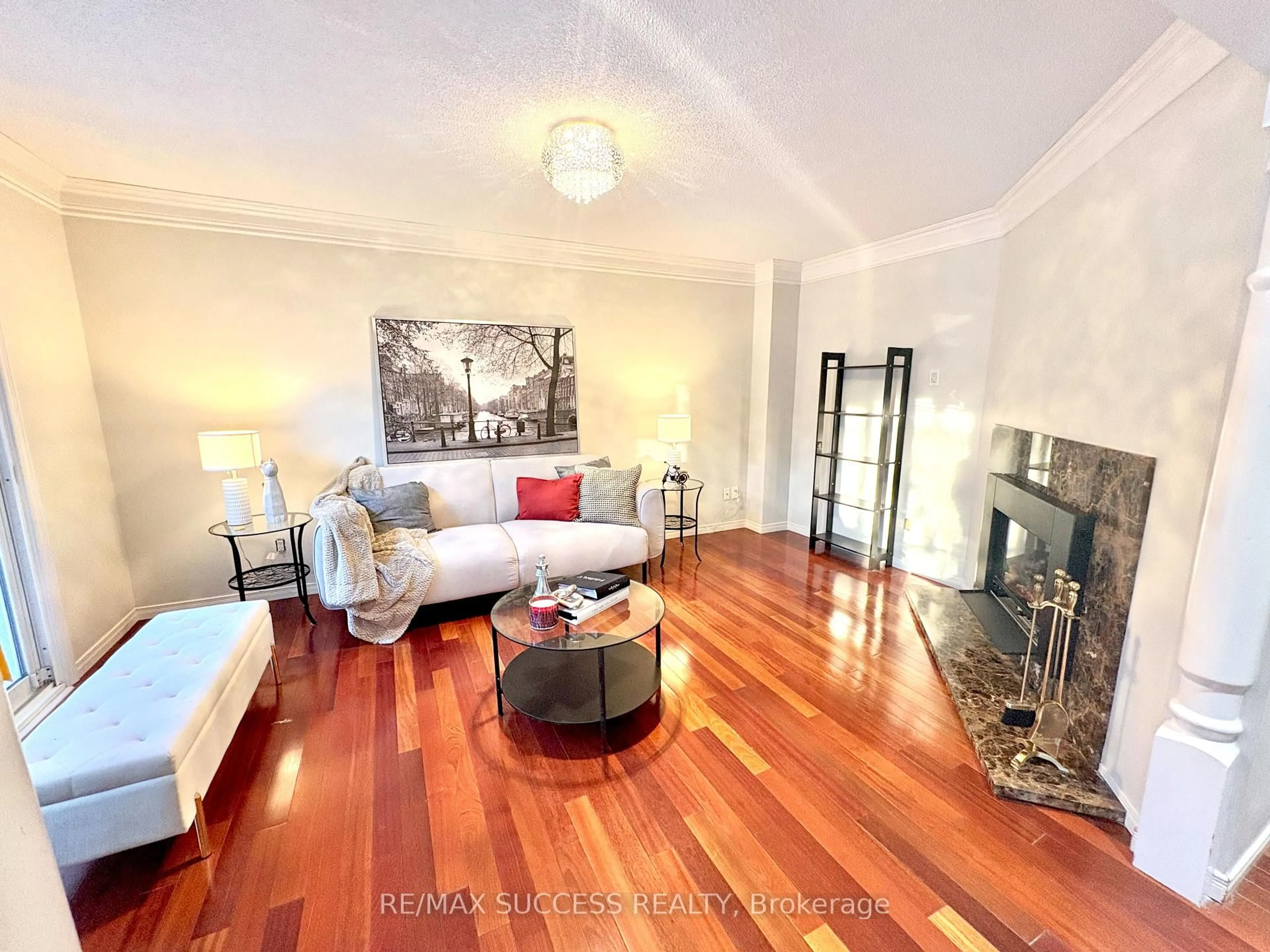 Living room with furniture, wood/laminate floor for 6643 Mockingbird Lane, Mississauga Ontario L5N 5K2