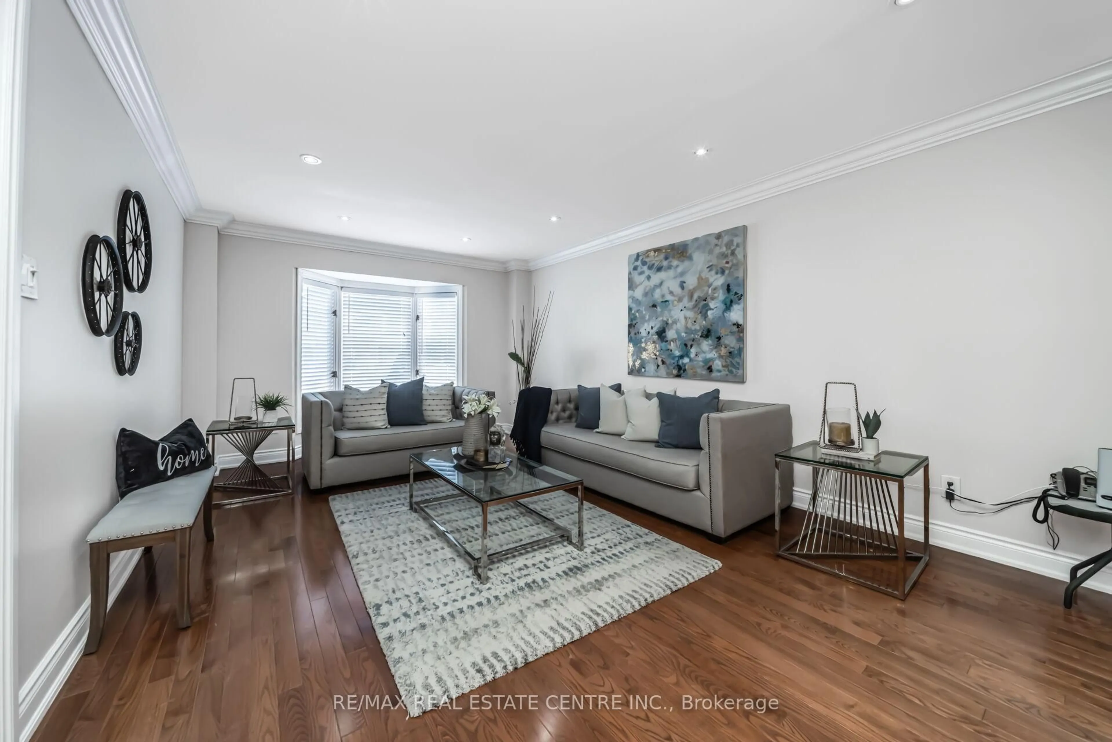 Living room with furniture, wood/laminate floor for 11 Moorehead Cres, Brampton Ontario L6Z 4K6