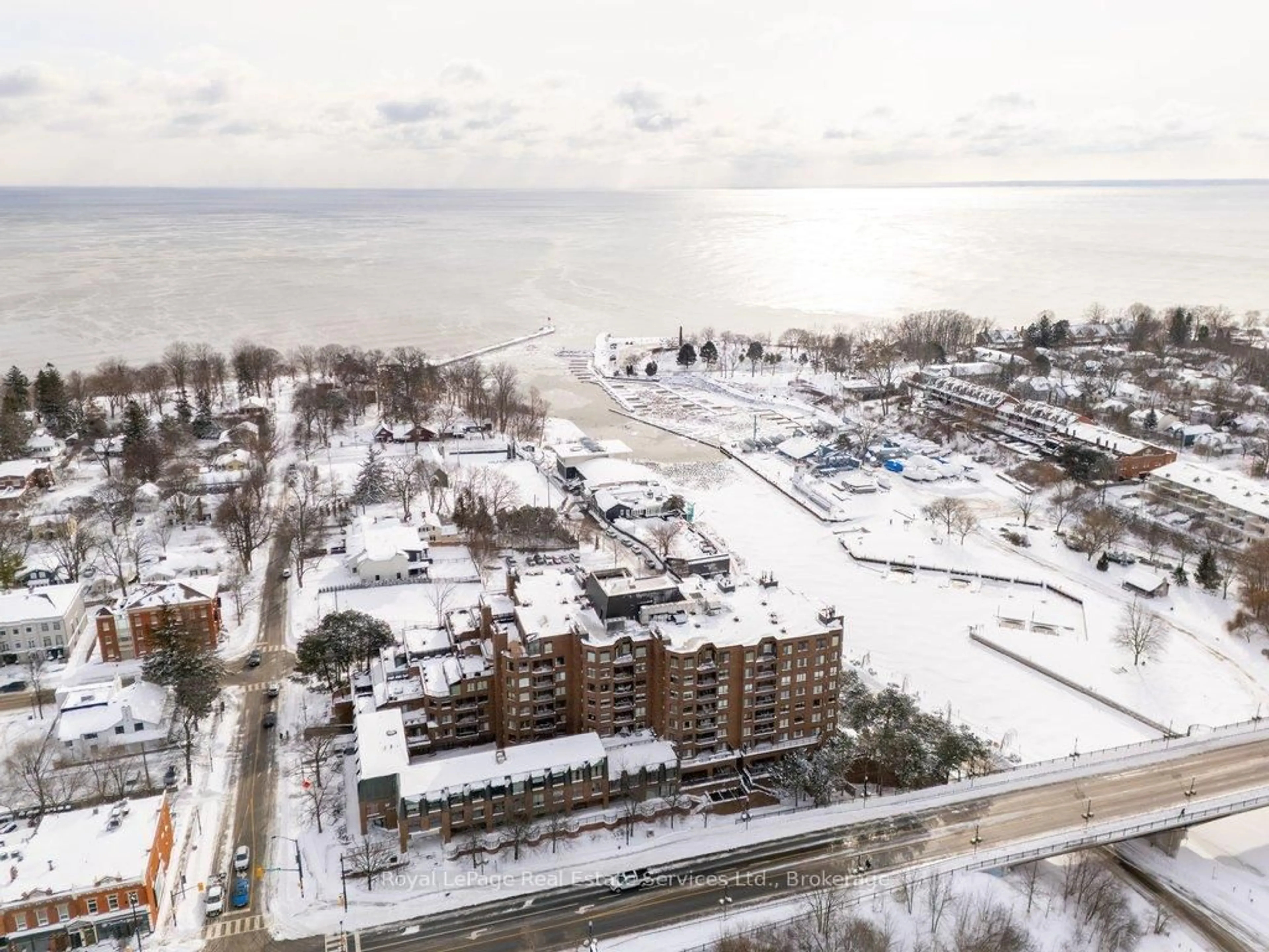 A pic from outside/outdoor area/front of a property/back of a property/a pic from drone, water/lake/river/ocean view for 100 Lakeshore Rd #102, Oakville Ontario L6J 6M9