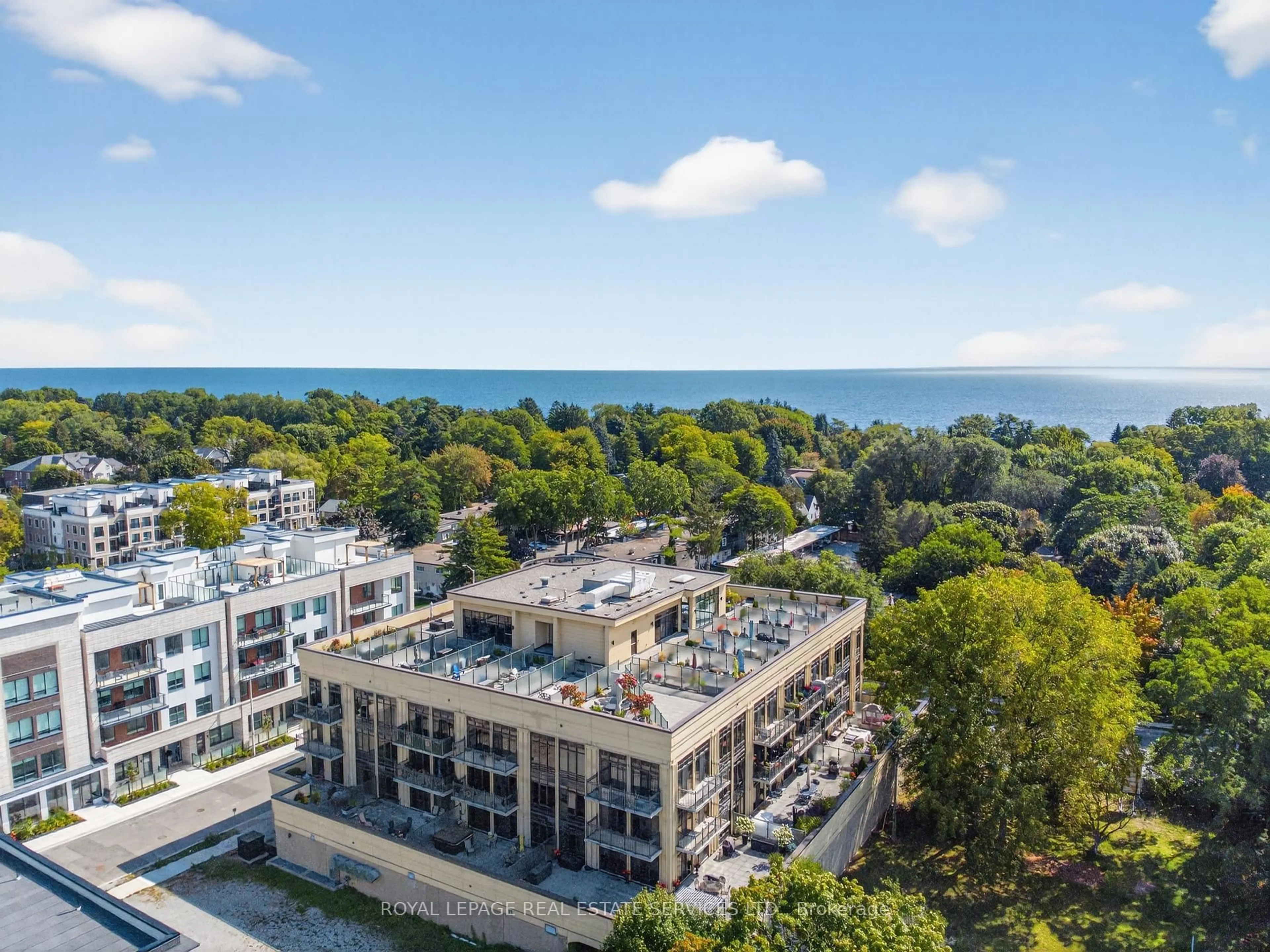 A pic from outside/outdoor area/front of a property/back of a property/a pic from drone, water/lake/river/ocean view for 205 Lakeshore Rd #410, Oakville Ontario L6K 0H8