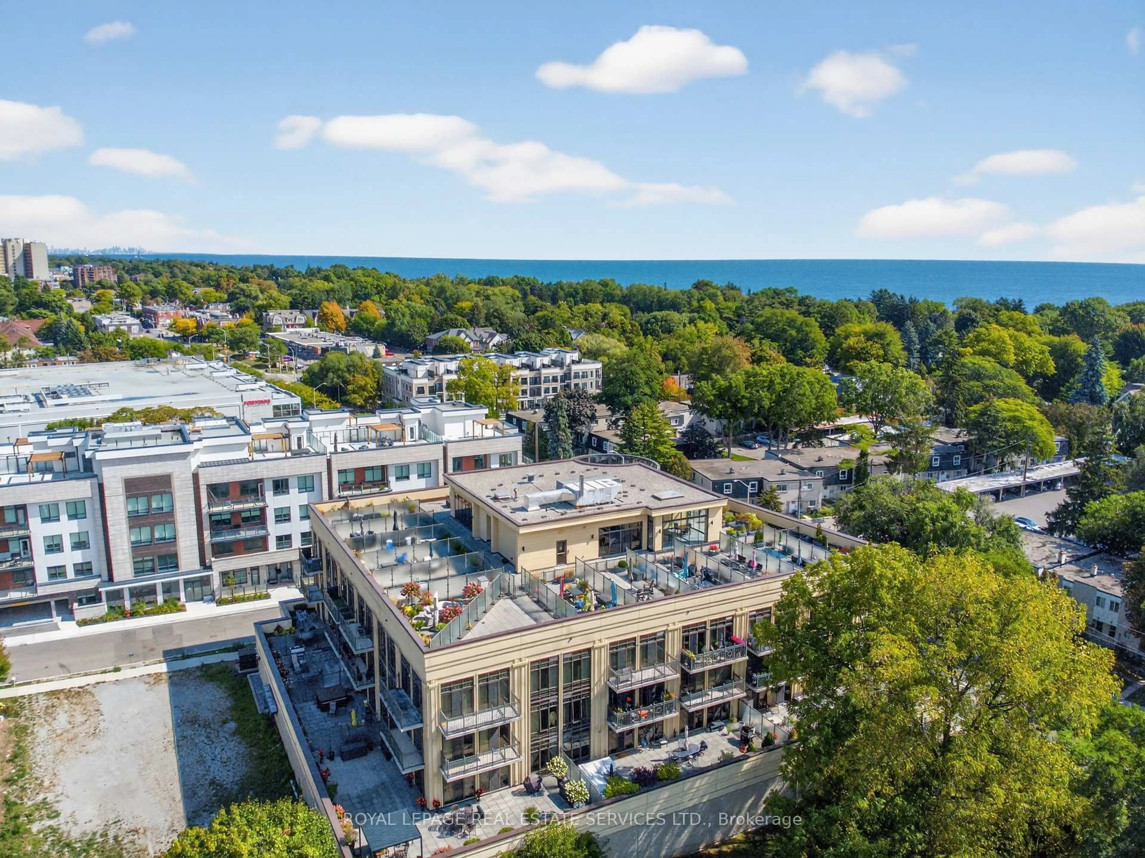 A pic from outside/outdoor area/front of a property/back of a property/a pic from drone, water/lake/river/ocean view for 205 Lakeshore Rd #410, Oakville Ontario L6K 0H8