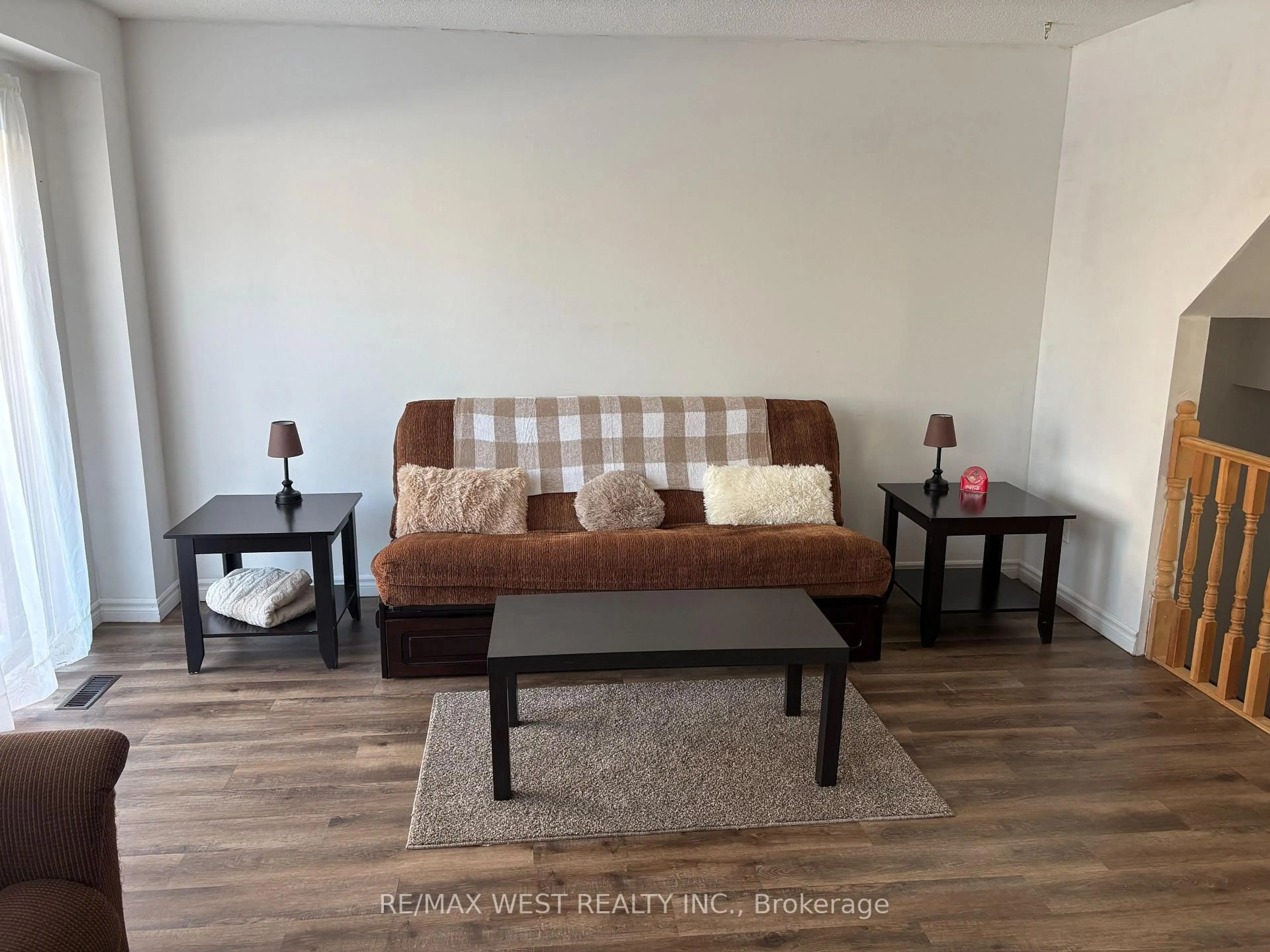 Living room with furniture, wood/laminate floor for 346 Fleetwood Cres, Brampton Ontario L6T 2E7