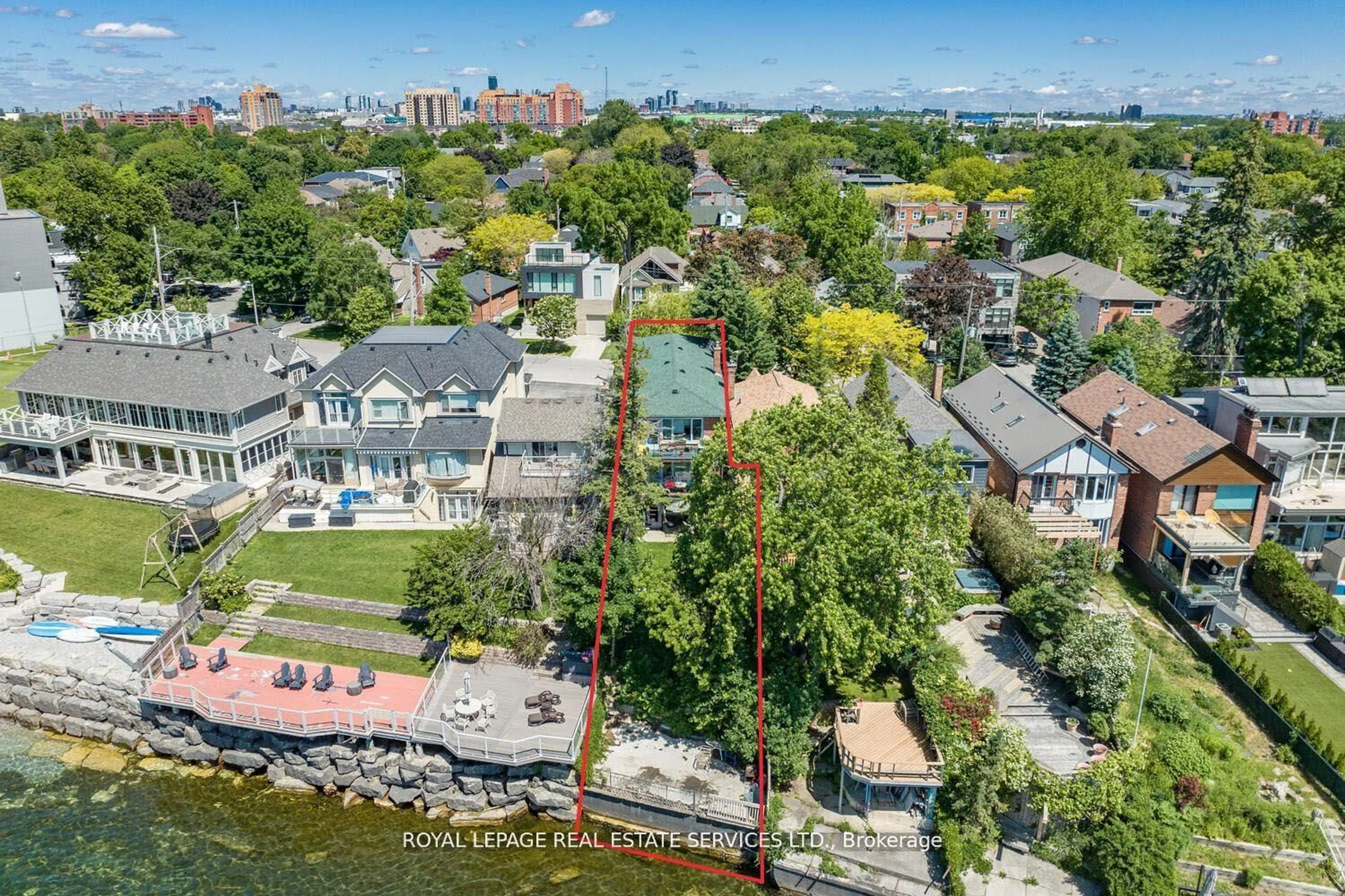 A pic from outside/outdoor area/front of a property/back of a property/a pic from drone, water/lake/river/ocean view for 135 Lake Shore Dr, Toronto Ontario M8V 2A1