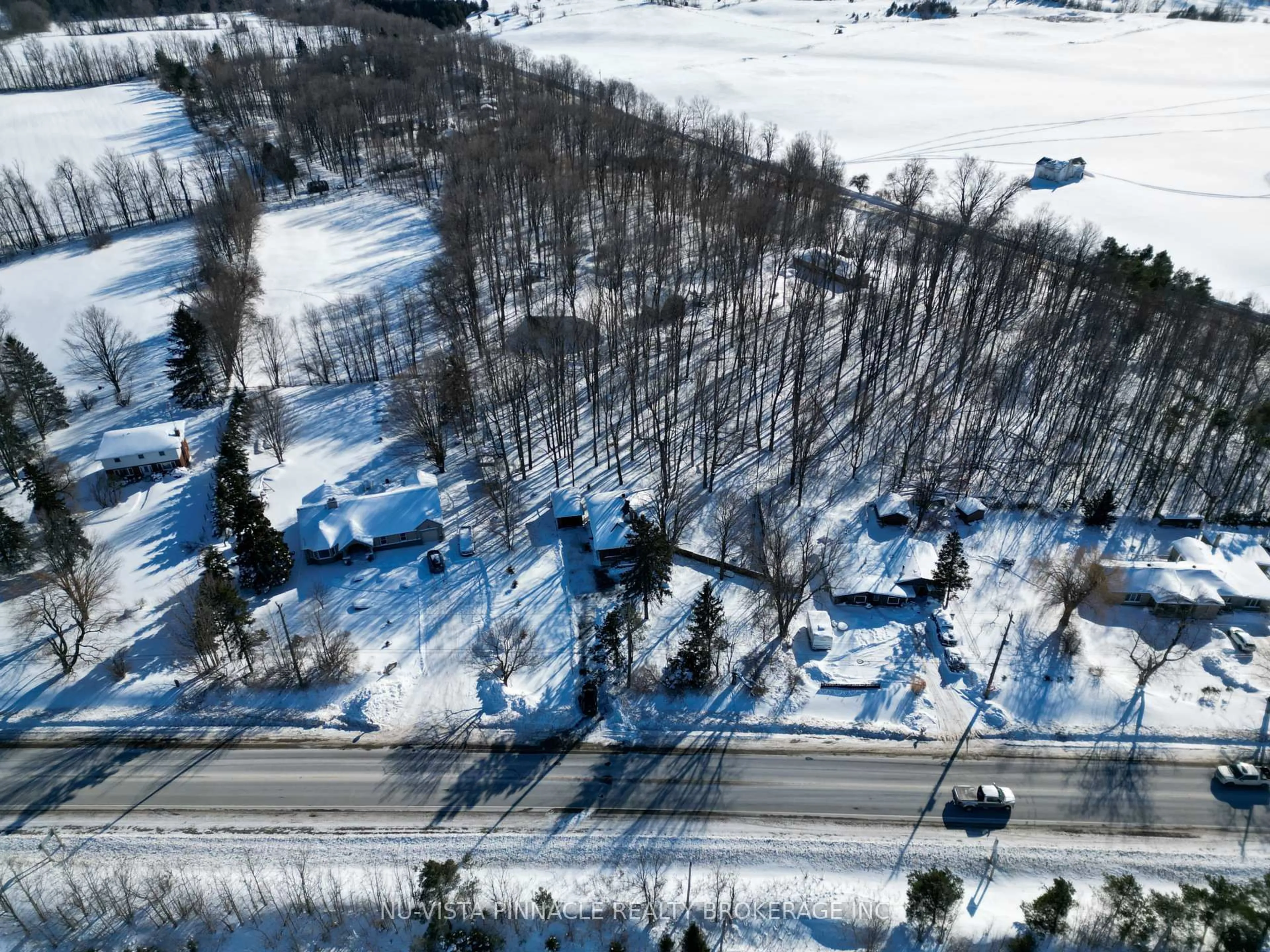 A pic from outside/outdoor area/front of a property/back of a property/a pic from drone, forest/trees view for 7142 HIGHWAY 7, Halton Hills Ontario L7J 2L9