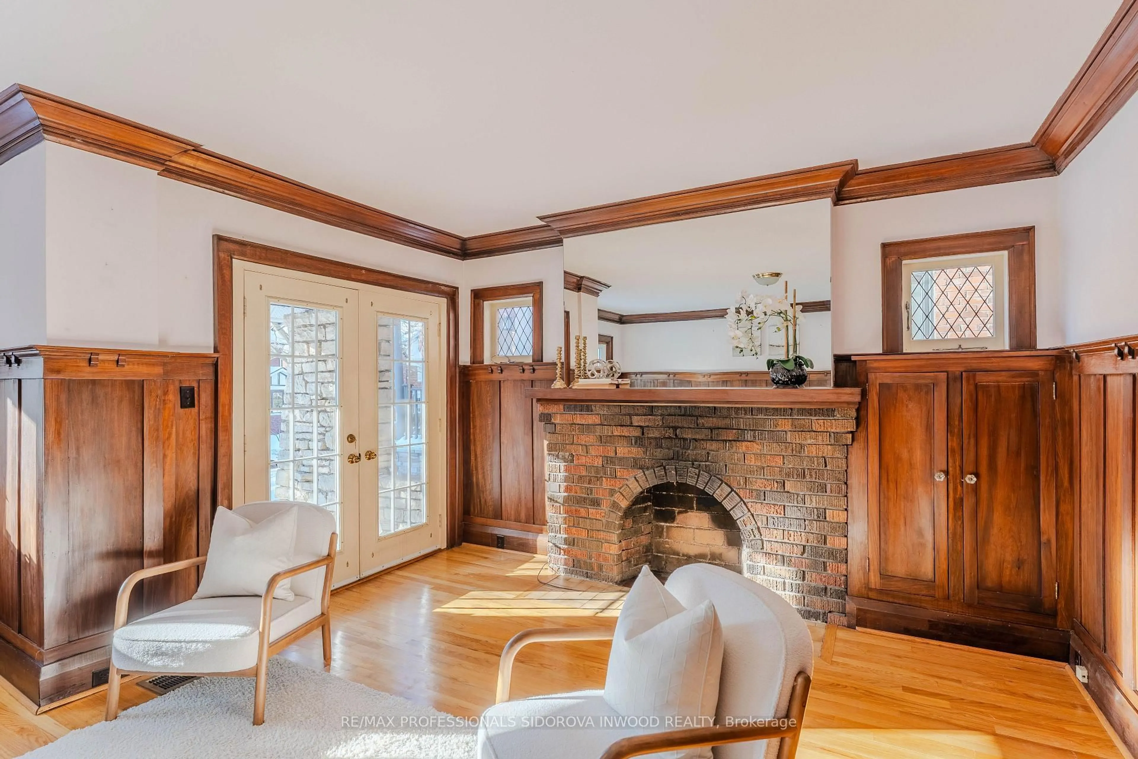 Living room with furniture, wood/laminate floor for 11 Indian Grve, Toronto Ontario M6R 2Y1