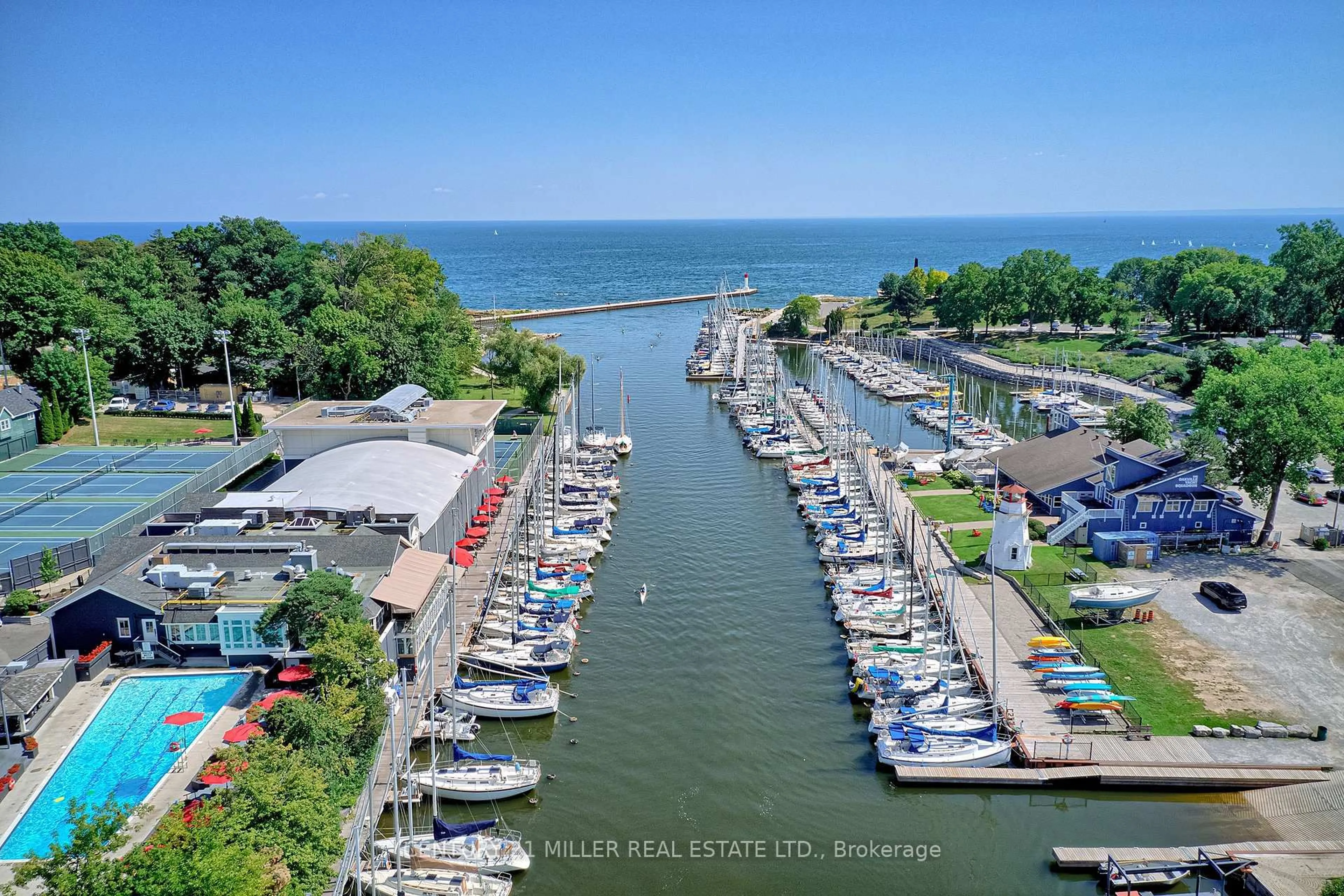 A pic from outside/outdoor area/front of a property/back of a property/a pic from drone, water/lake/river/ocean view for 100 Lakeshore Rd #201, Oakville Ontario L6J 6M9