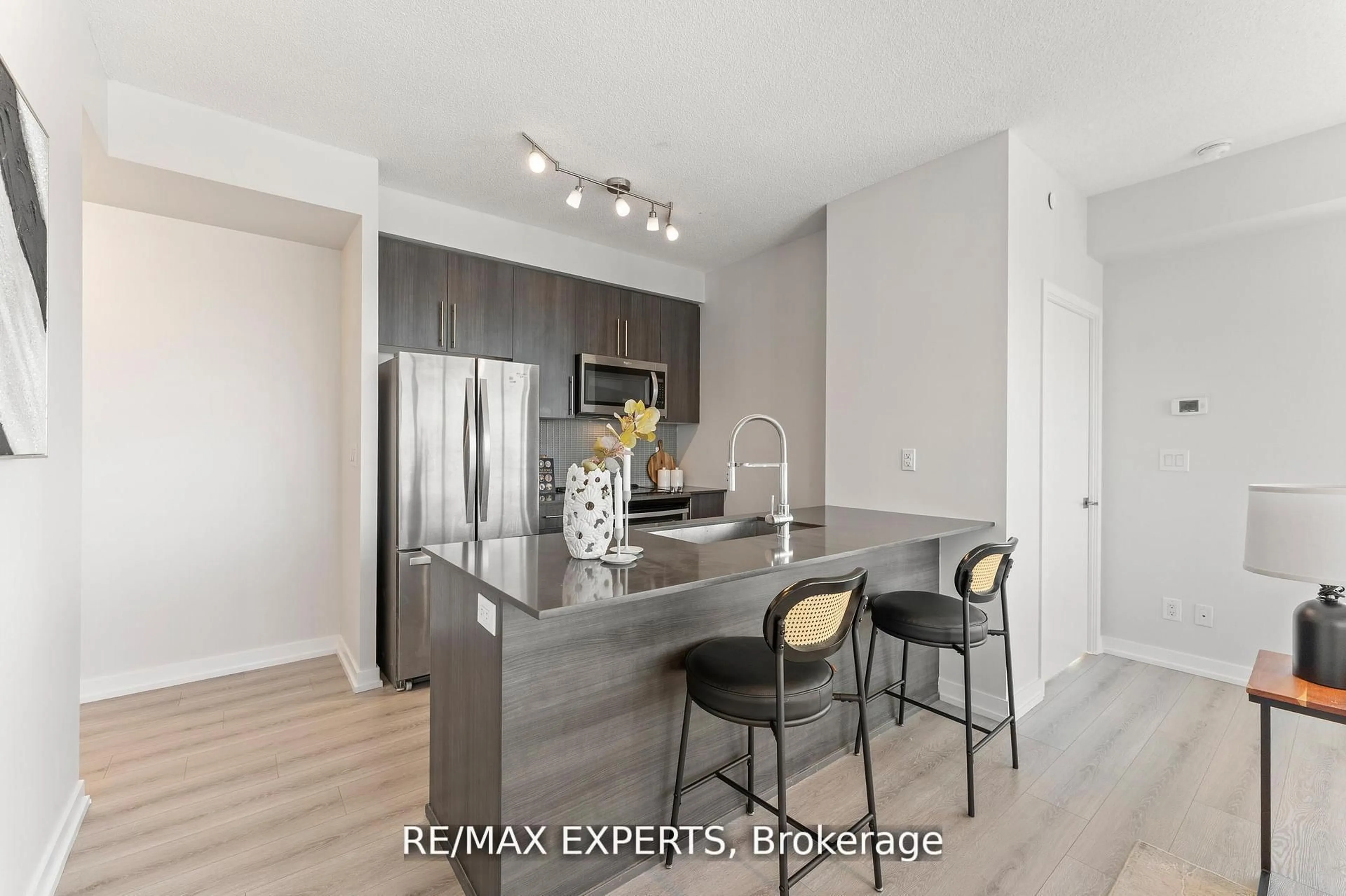 Open concept kitchen, wood/laminate floor for 4011 Brickstone Mews #4502, Mississauga Ontario L5B 0G3