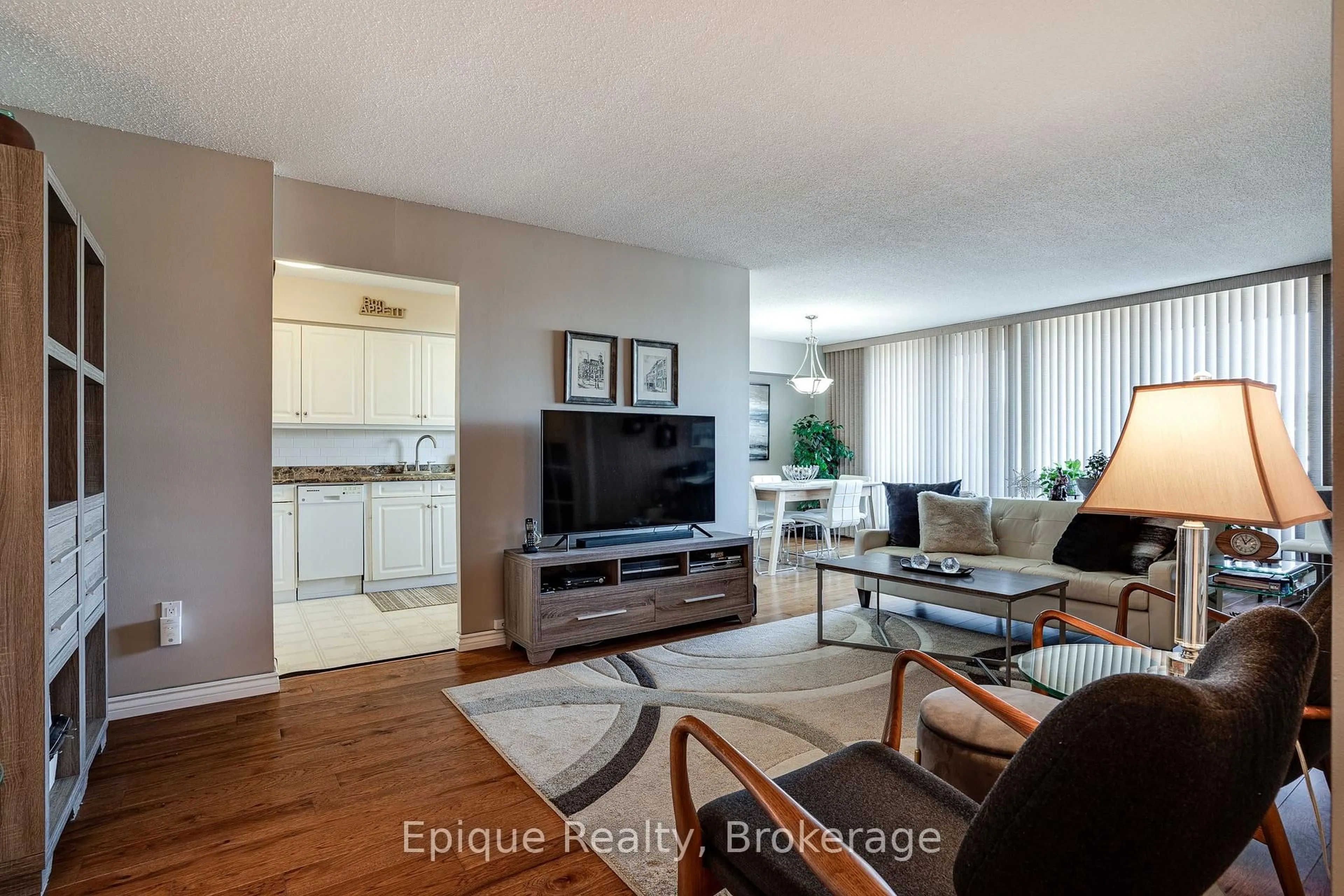 Living room with furniture, wood/laminate floor for 2055 UPPER MIDDLE Rd #409, Burlington Ontario L7P 3P4