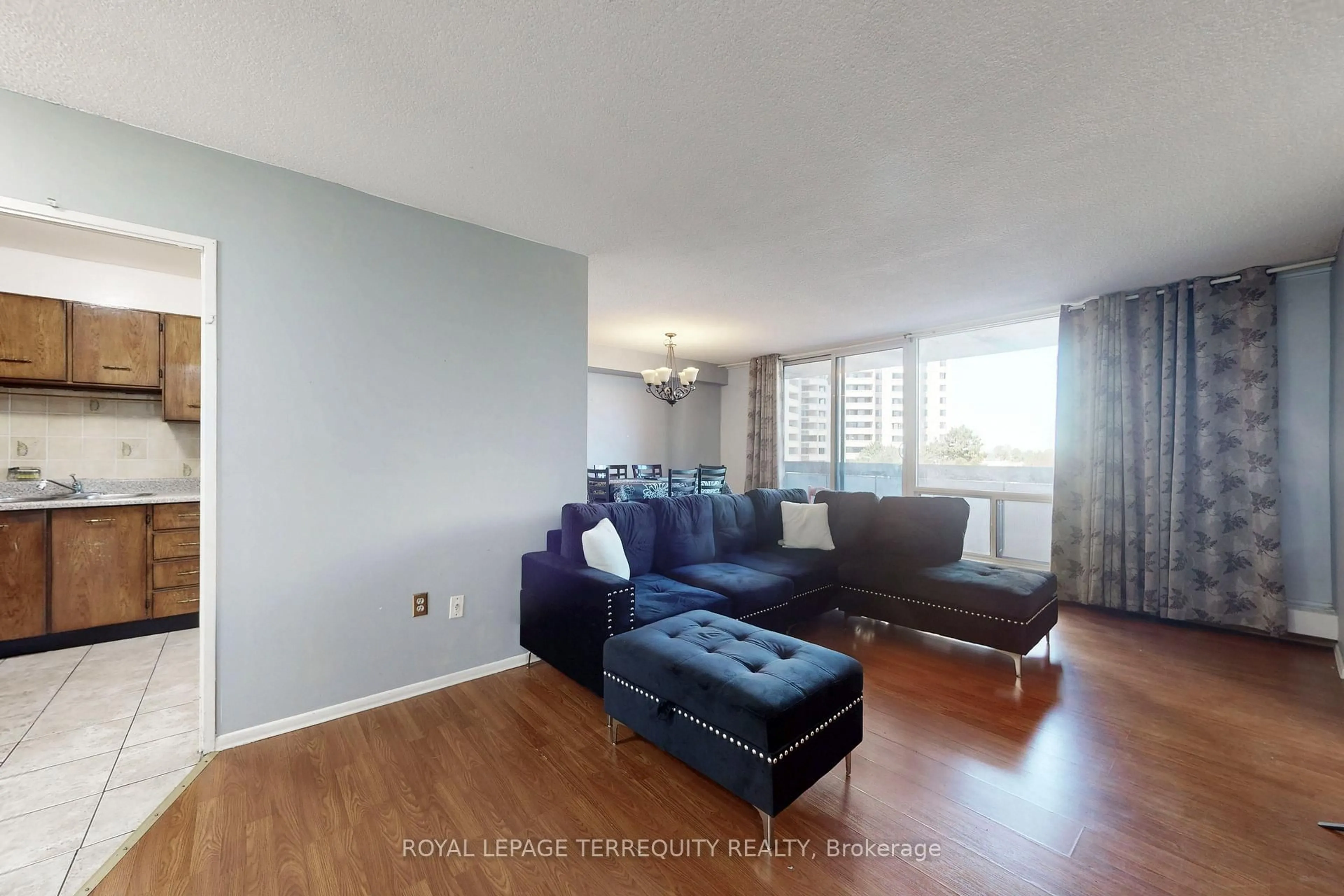 Living room with furniture, wood/laminate floor for 5 San Romano Way #410, Toronto Ontario M3N 2Y4