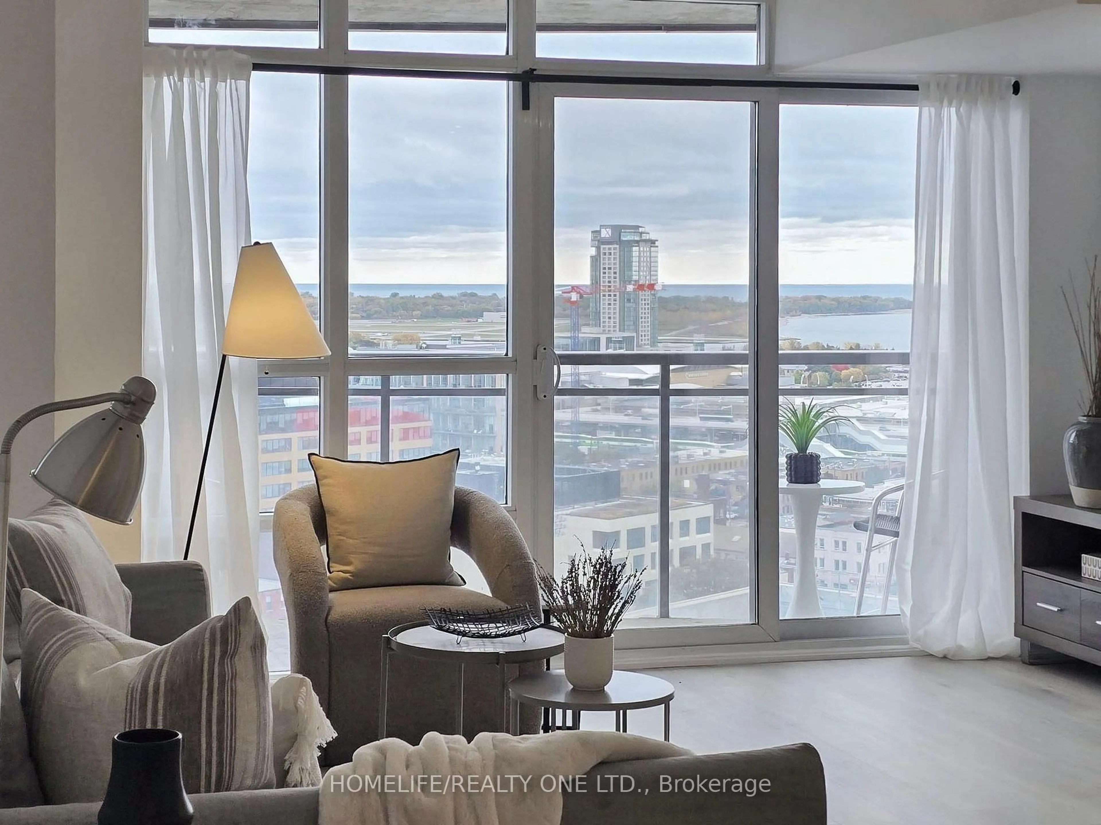 Living room with furniture, unknown for 38 Joe Shuster Way #2003, Toronto Ontario M6K 0A5