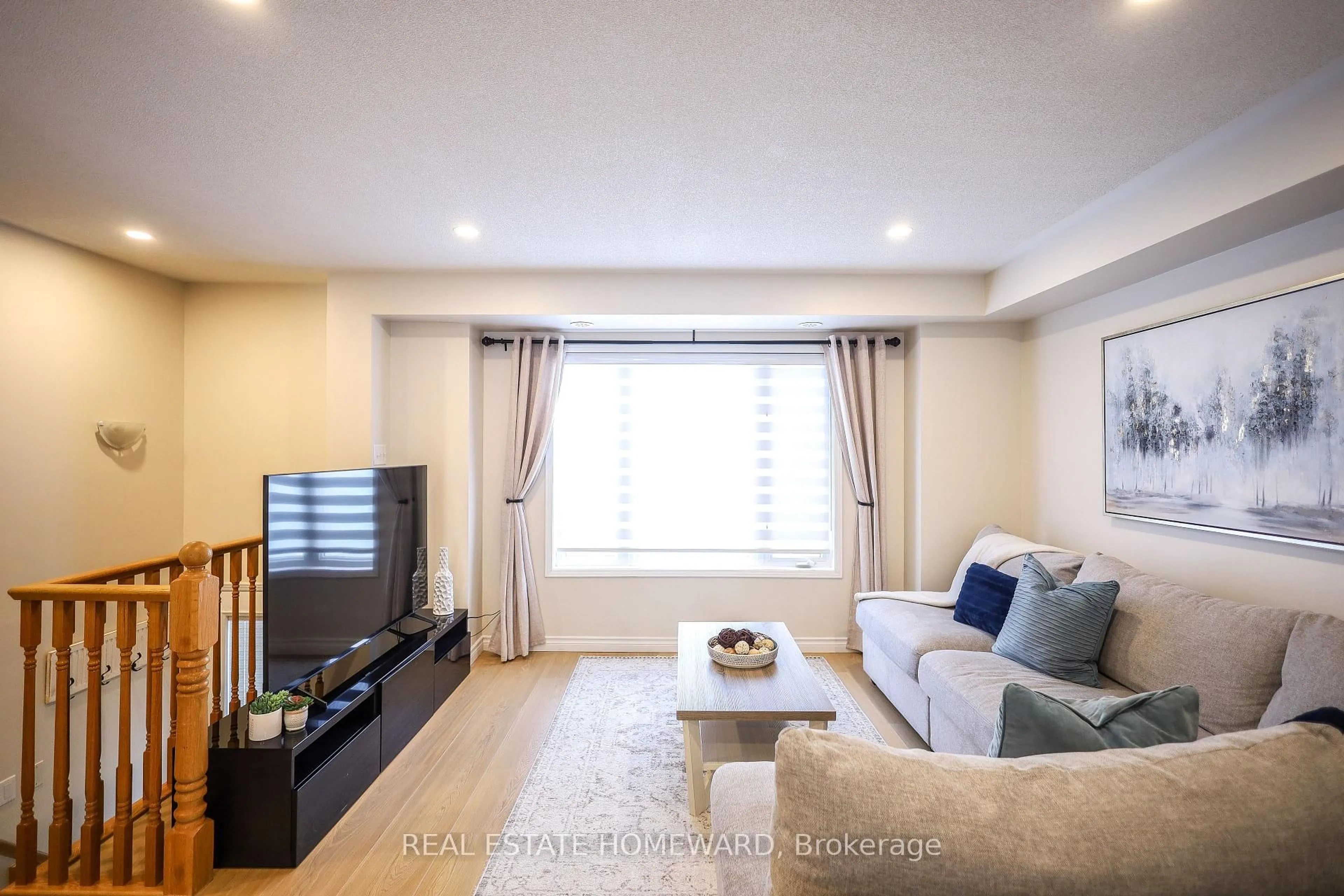 Living room with furniture, wood/laminate floor for 5650 Winston Churchill Blvd #51, Mississauga Ontario L5M 0L8
