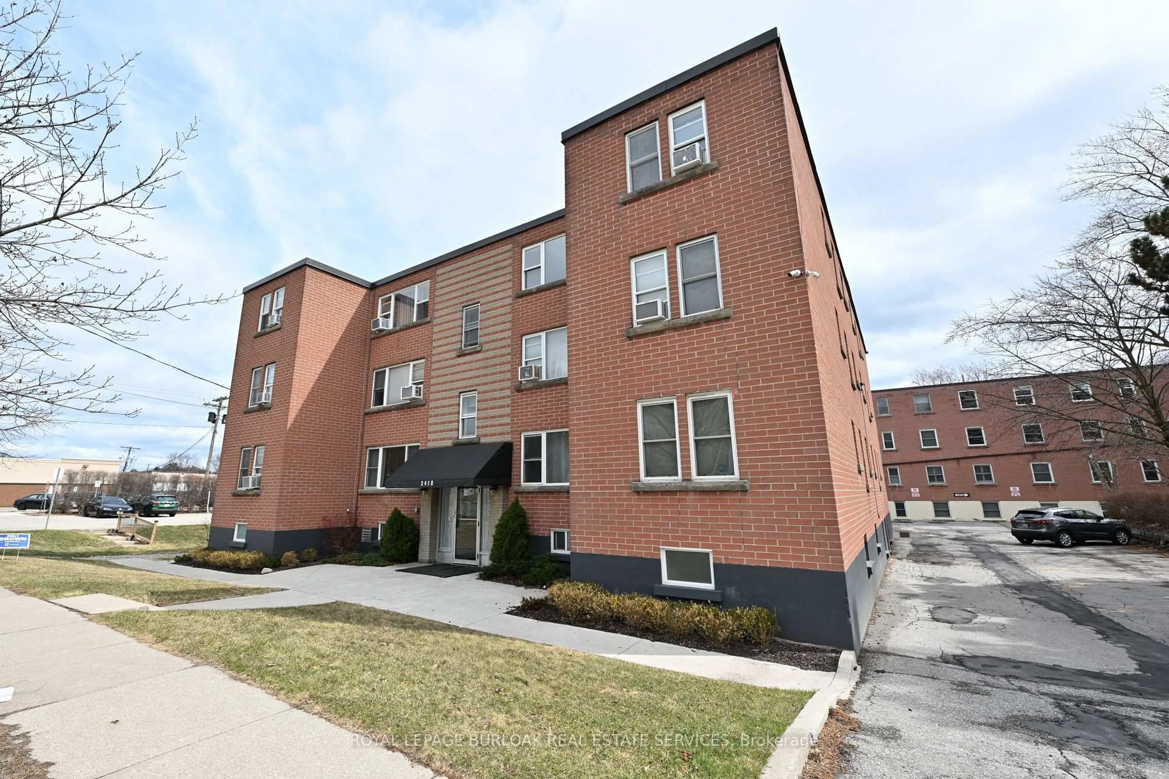 Home with brick exterior material, street for 2418 New St #11, Burlington Ontario L7R 1J6